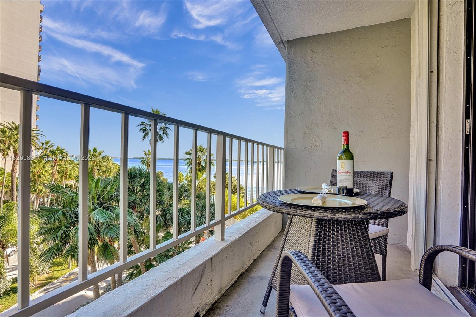 200 Southeast 15th Road, Unit 6I Miami, FL 33129 - Photo 13 of 50 a dining room with furniture a garden and mountain view