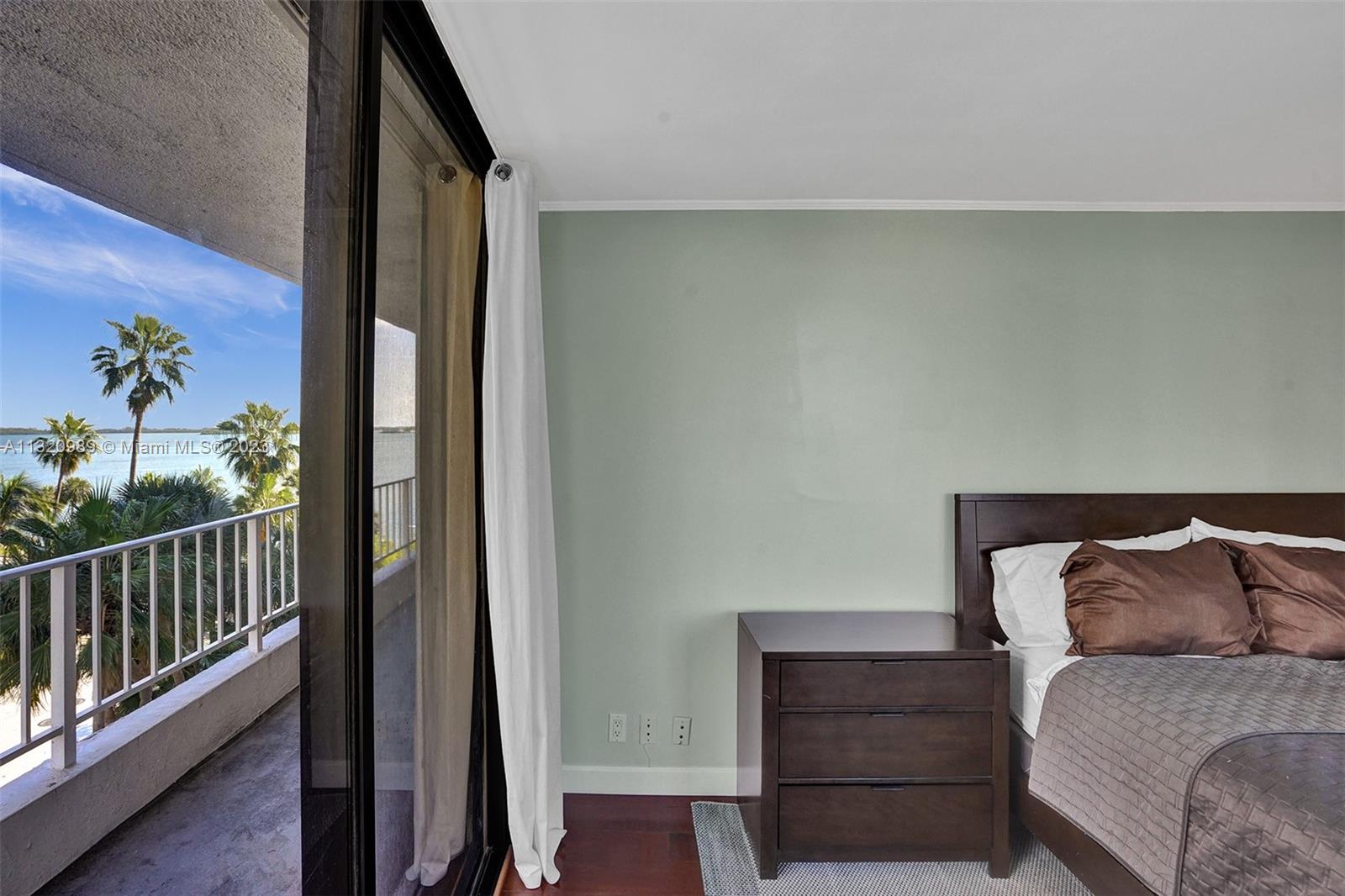 200 Southeast 15th Road, Unit 6I Miami, FL 33129 - Photo 22 of 50 a bedroom with a bed and a window