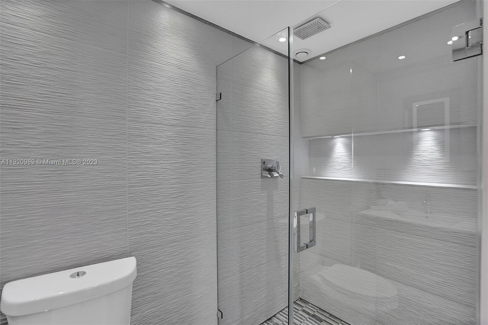 200 Southeast 15th Road, Unit 6I Miami, FL 33129 - Photo 24 of 50 a bathroom with a shower and toilet