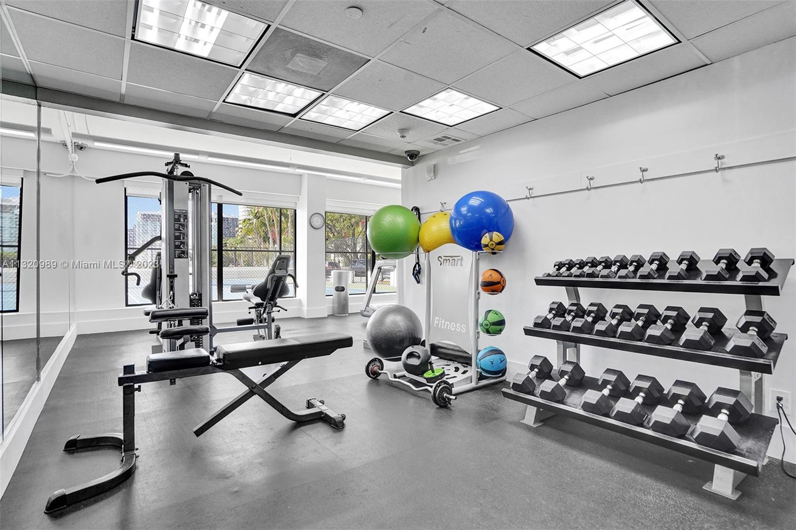 200 Southeast 15th Road, Unit 6I Miami, FL 33129 - Photo 31 of 50 a room with gym equipment and large window