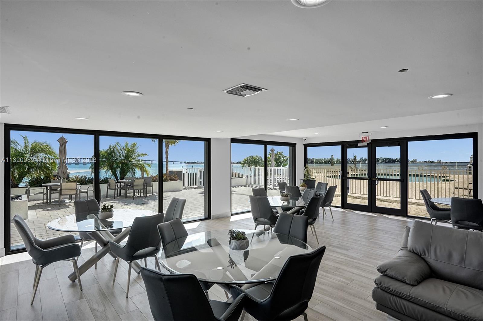 200 Southeast 15th Road, Unit 6I Miami, FL 33129 - Photo 33 of 50 a living room with furniture and floor to ceiling windows