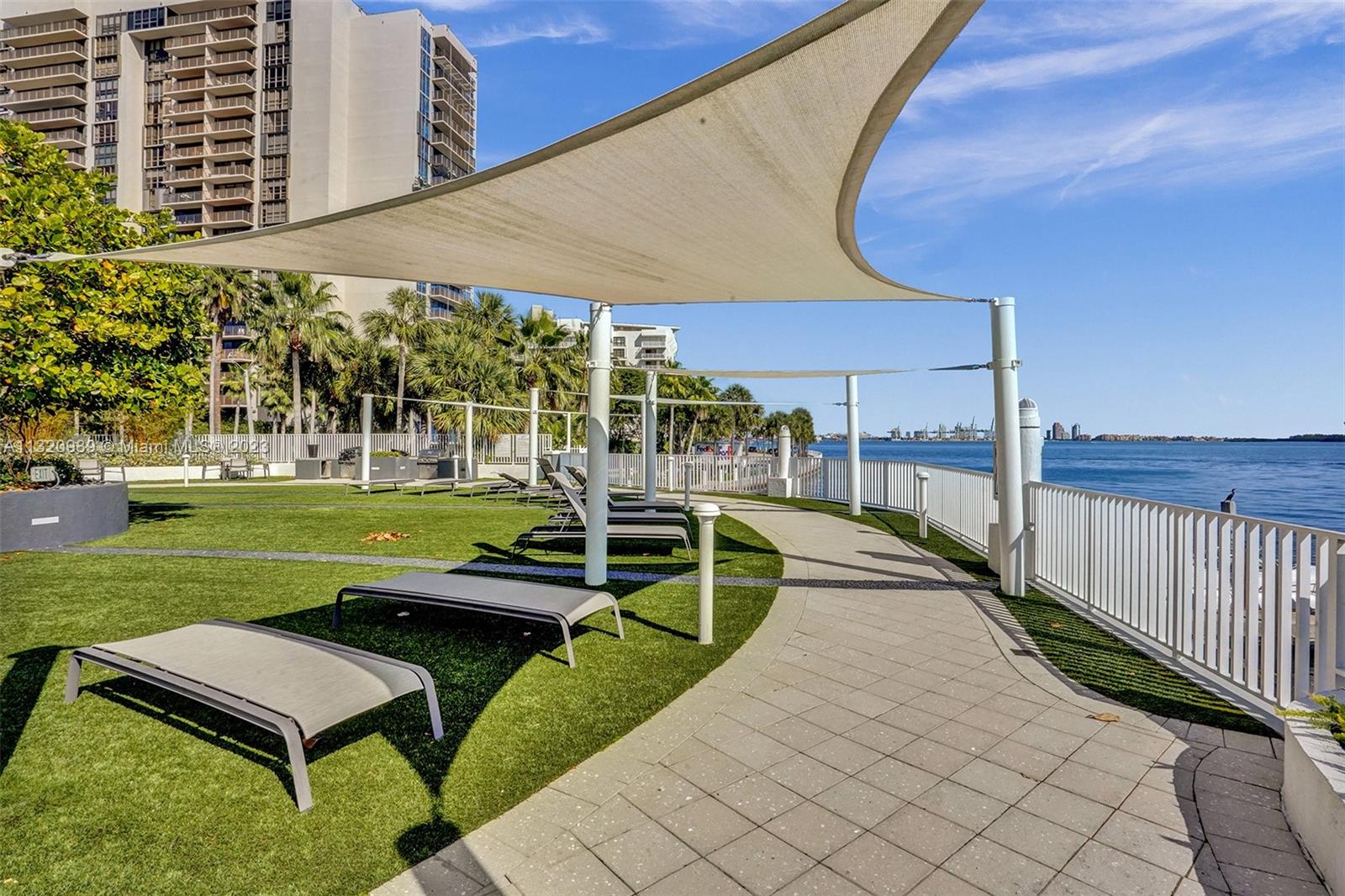 200 Southeast 15th Road, Unit 6I Miami, FL 33129 - Photo 38 of 50 a view of a swimming pool with a bench