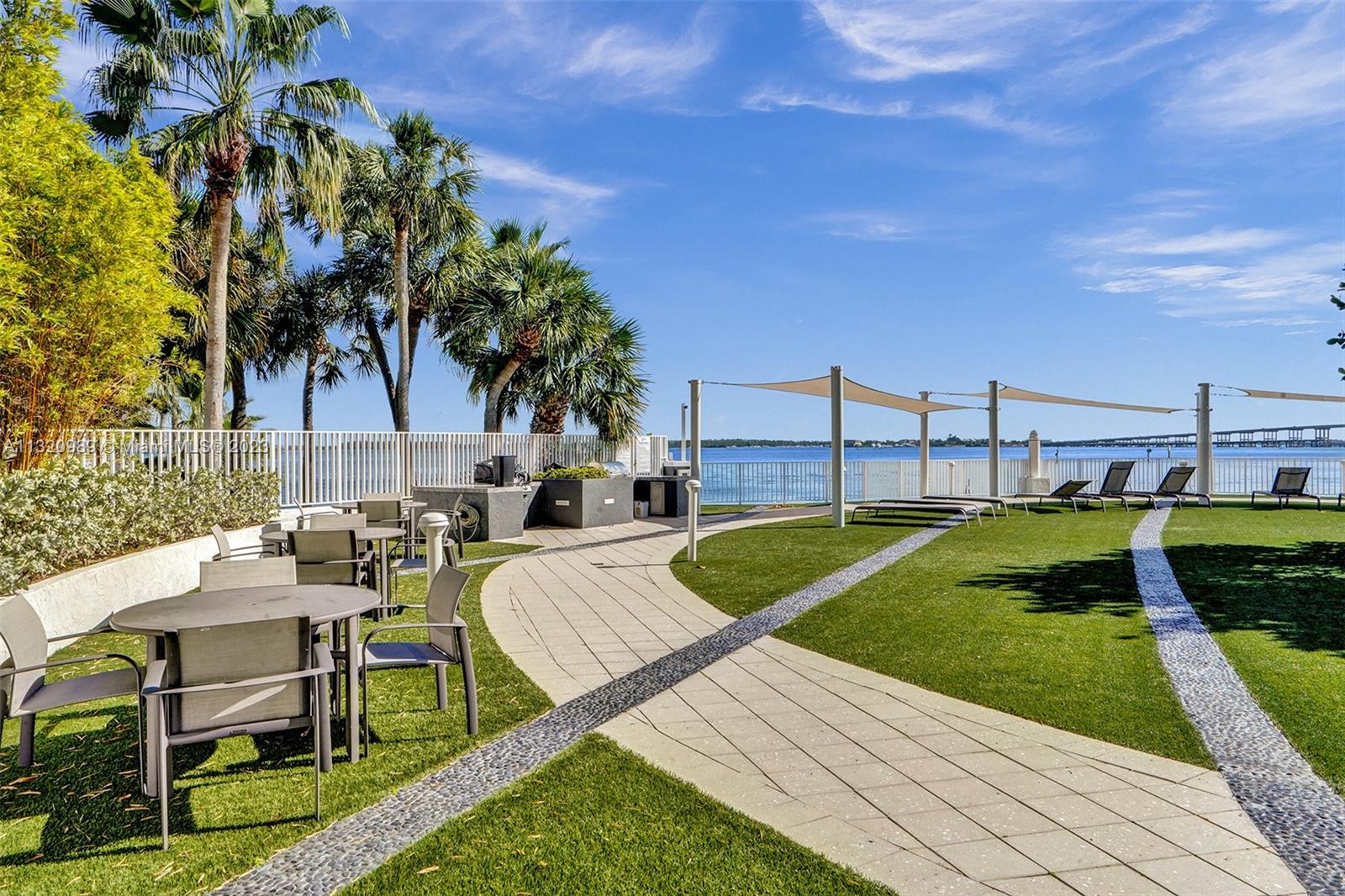 200 Southeast 15th Road, Unit 6I Miami, FL 33129 - Photo 40 of 50 a view of backyard with swimming pool and seating space