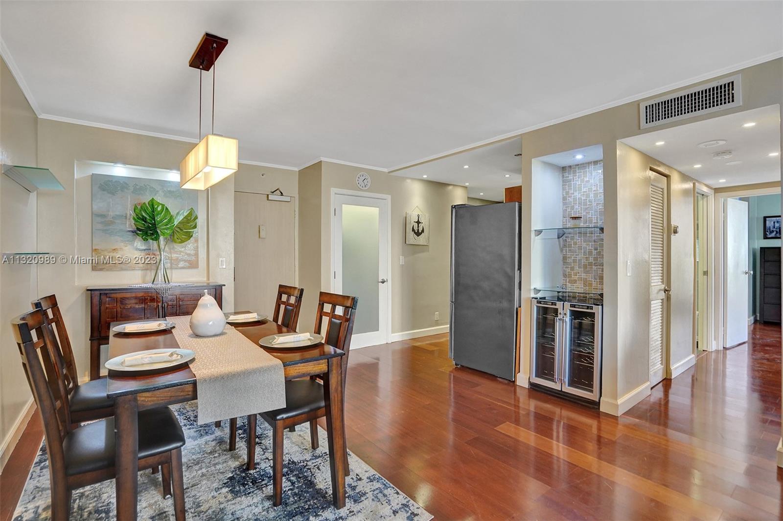 200 Southeast 15th Road, Unit 6I Miami, FL 33129 - Photo 4 of 50 a dining room with furniture and window