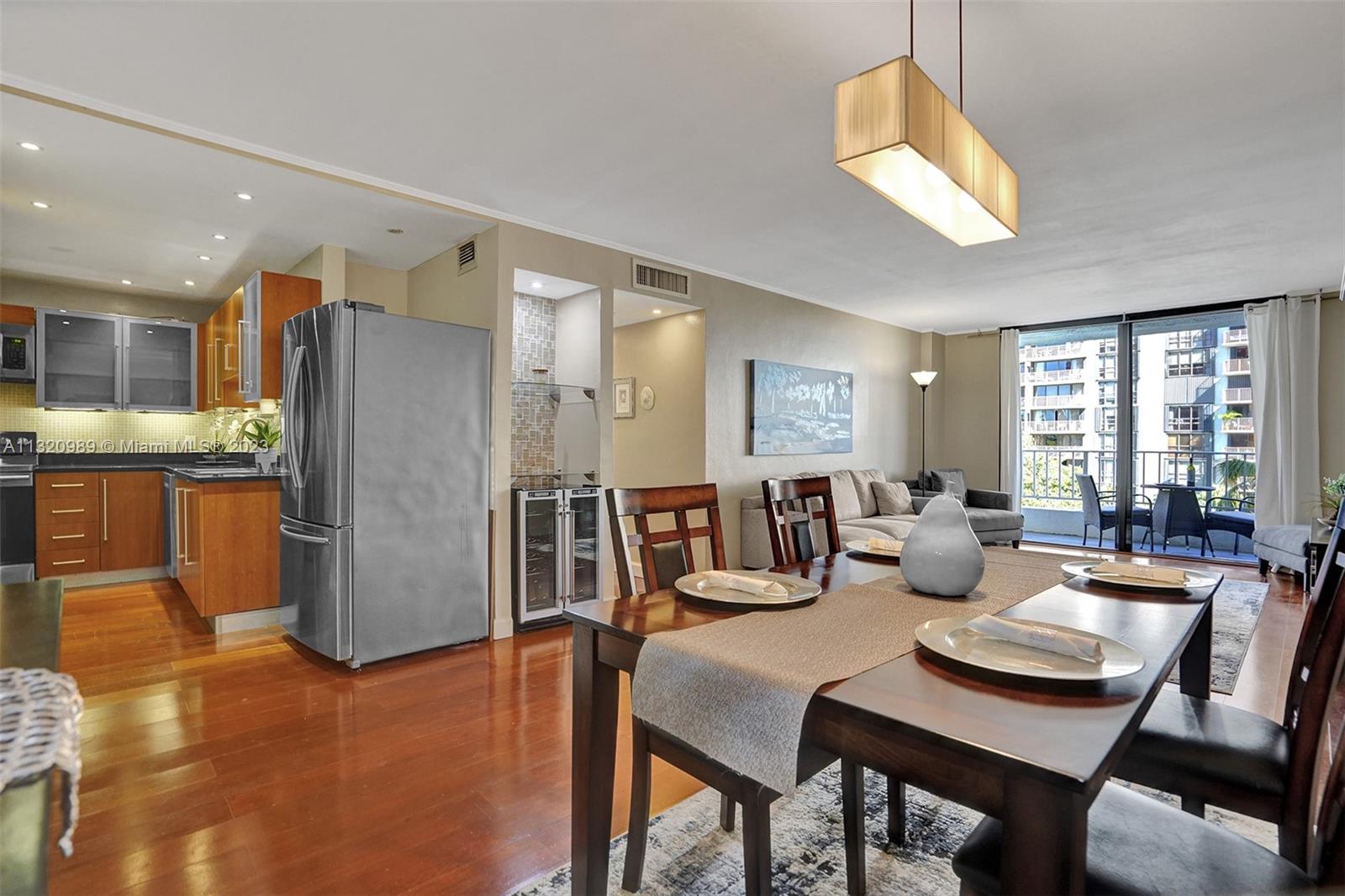 200 Southeast 15th Road, Unit 6I Miami, FL 33129 - Photo 5 of 50 a view of a dining room with furniture and a chandelier