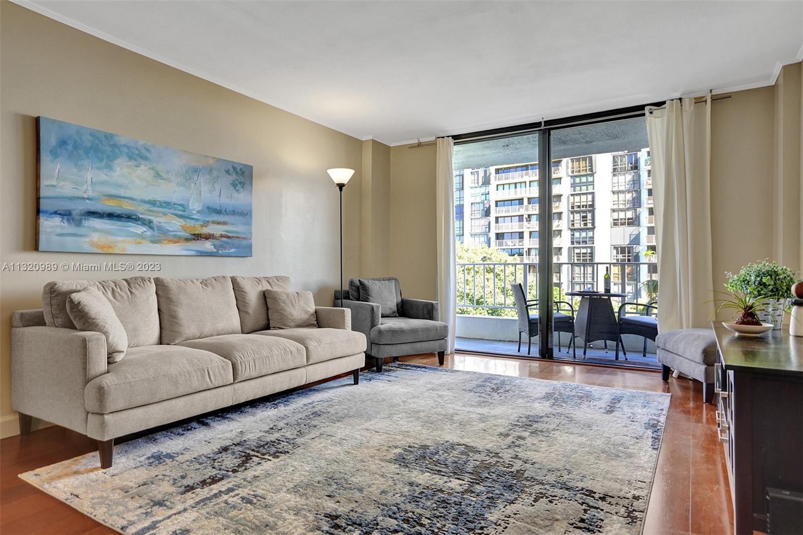 200 Southeast 15th Road, Unit 6I Miami, FL 33129 - Photo 10 of 50 a living room with furniture and a large window