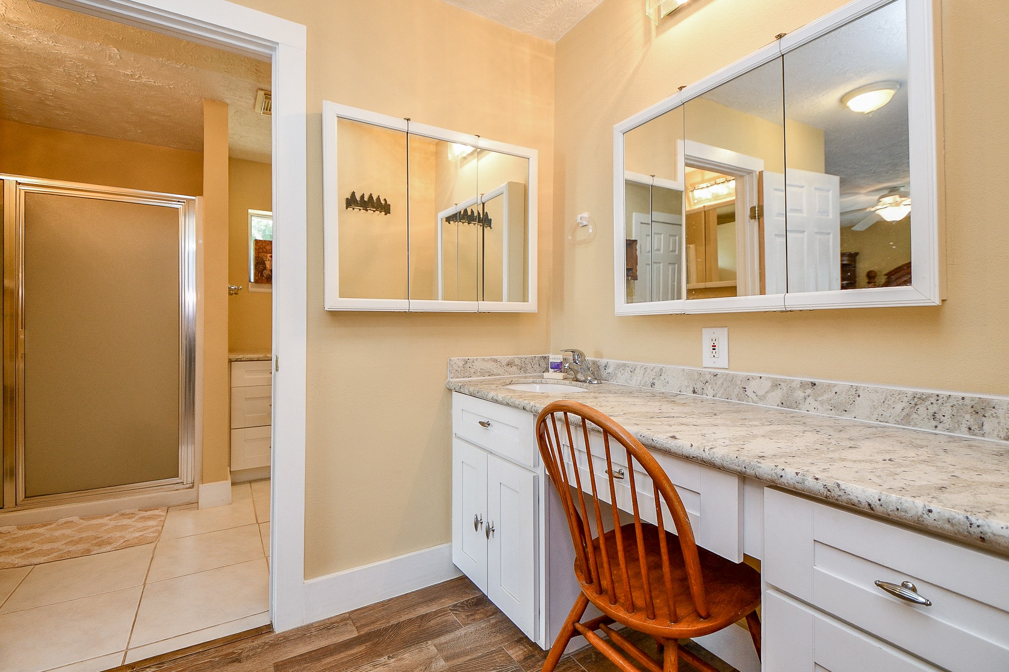 618 Keith Avenue Houston, TX 77504 - Photo 16 of 43 a bathroom with a granite countertop sink and a mirror