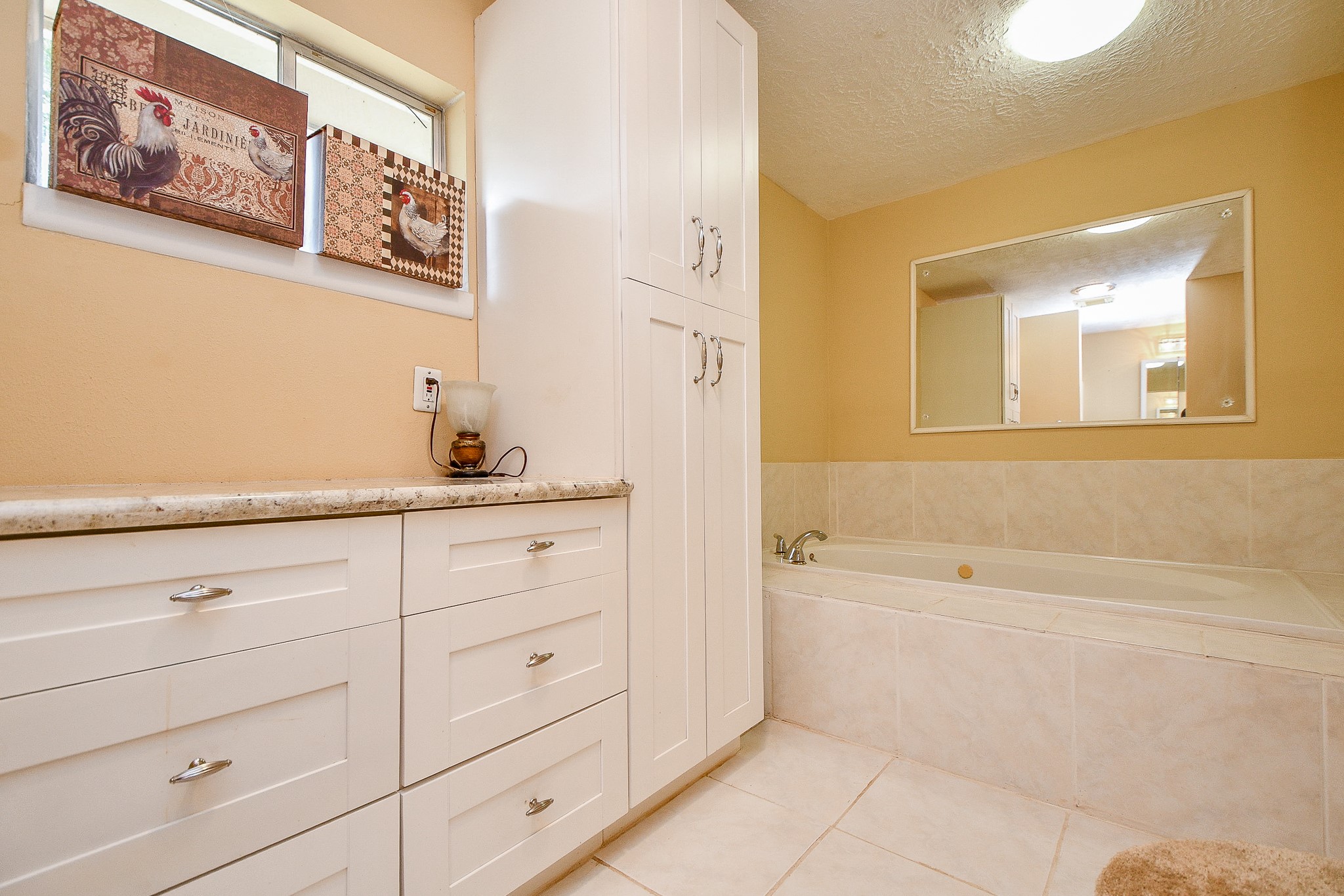 618 Keith Avenue Houston, TX 77504 - Photo 18 of 43 a bathroom with a bathtub and a sink