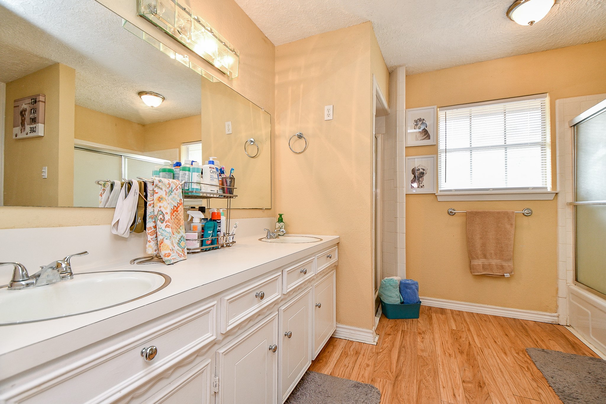 618 Keith Avenue Houston, TX 77504 - Photo 20 of 43 a spacious bathroom with a granite countertop sink mirror and a