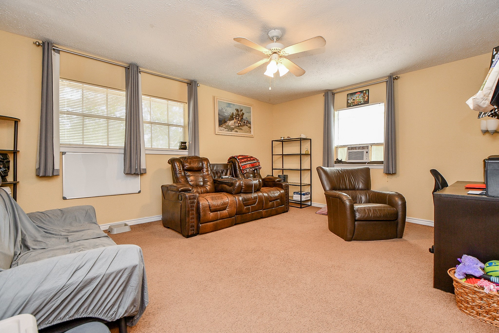 618 Keith Avenue Houston, TX 77504 - Photo 22 of 43 a living room with furniture and a large window