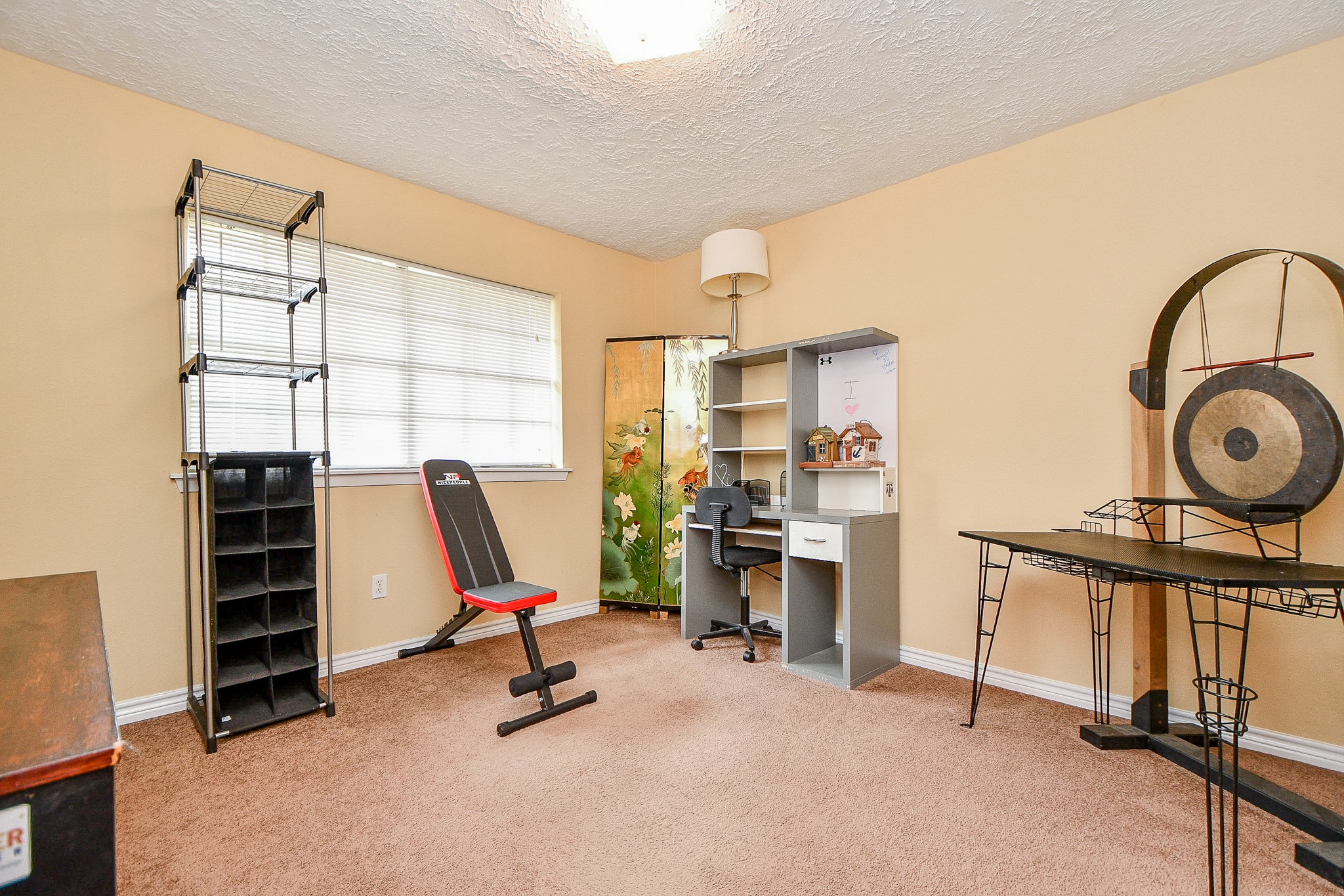 618 Keith Avenue Houston, TX 77504 - Photo 24 of 43 a view of a workspace with furniture and a window