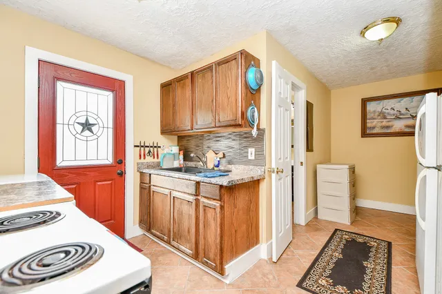 a kitchen with a stove and a sink