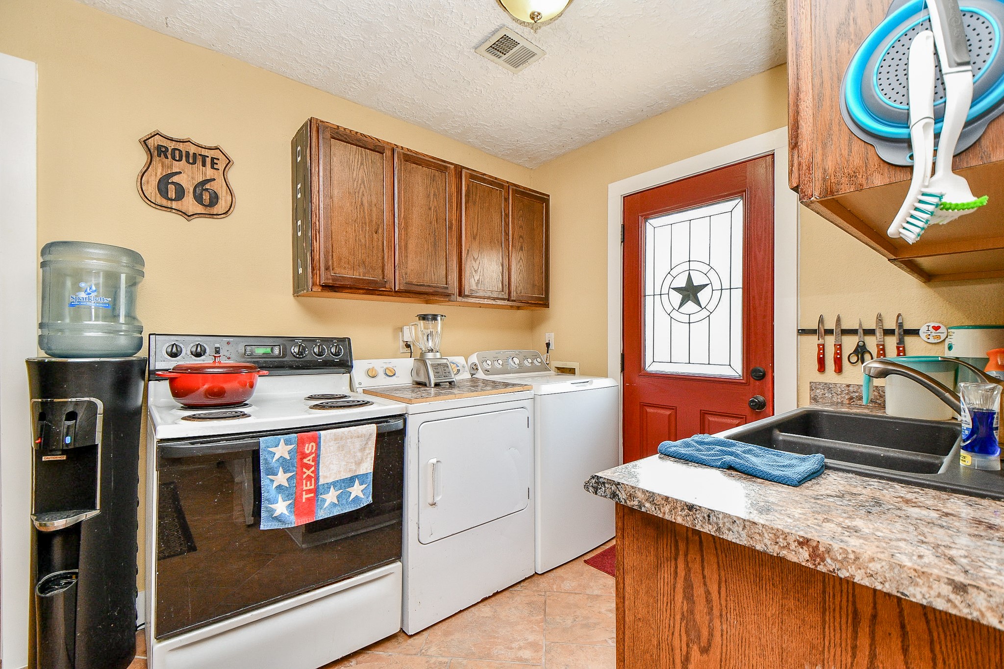 618 Keith Avenue Houston, TX 77504 - Photo 26 of 43 a kitchen with granite countertop a sink and a stove top oven