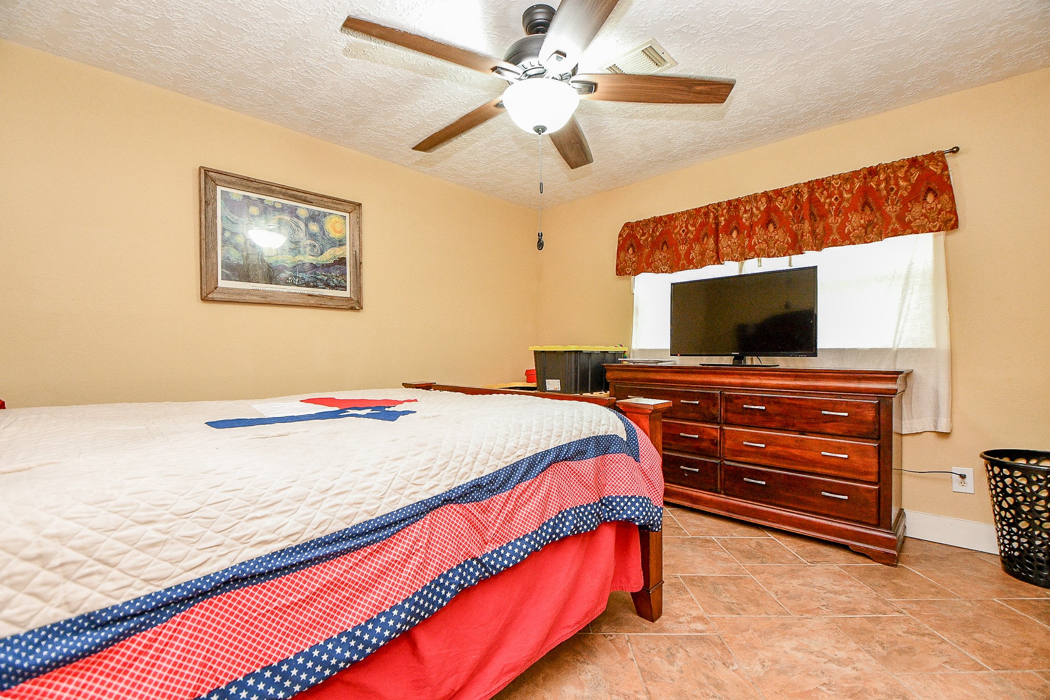 618 Keith Avenue Houston, TX 77504 - Photo 30 of 43 a bedroom with a bed and a flat screen tv