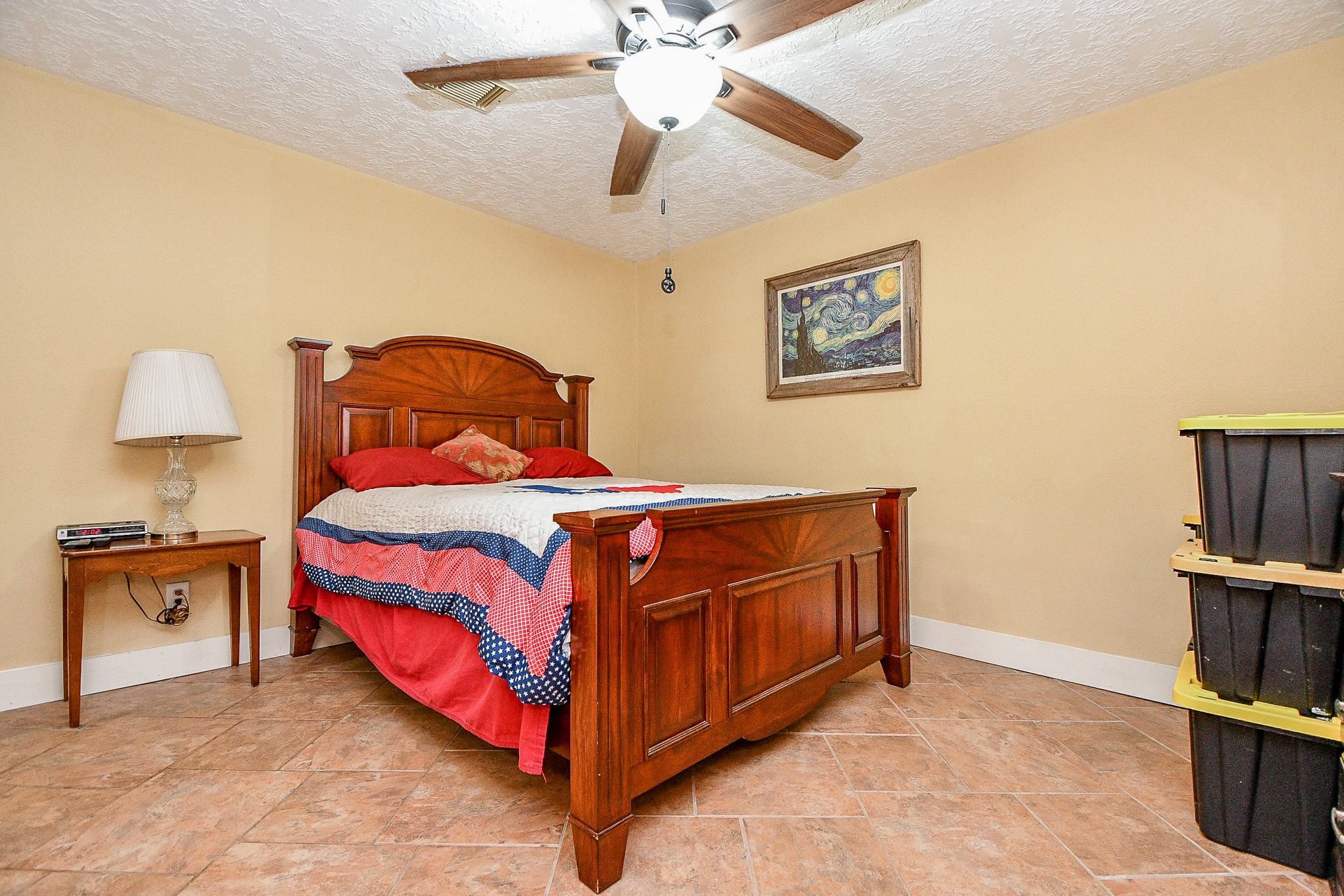 618 Keith Avenue Houston, TX 77504 - Photo 31 of 43 a bedroom with a bed and a book shelf