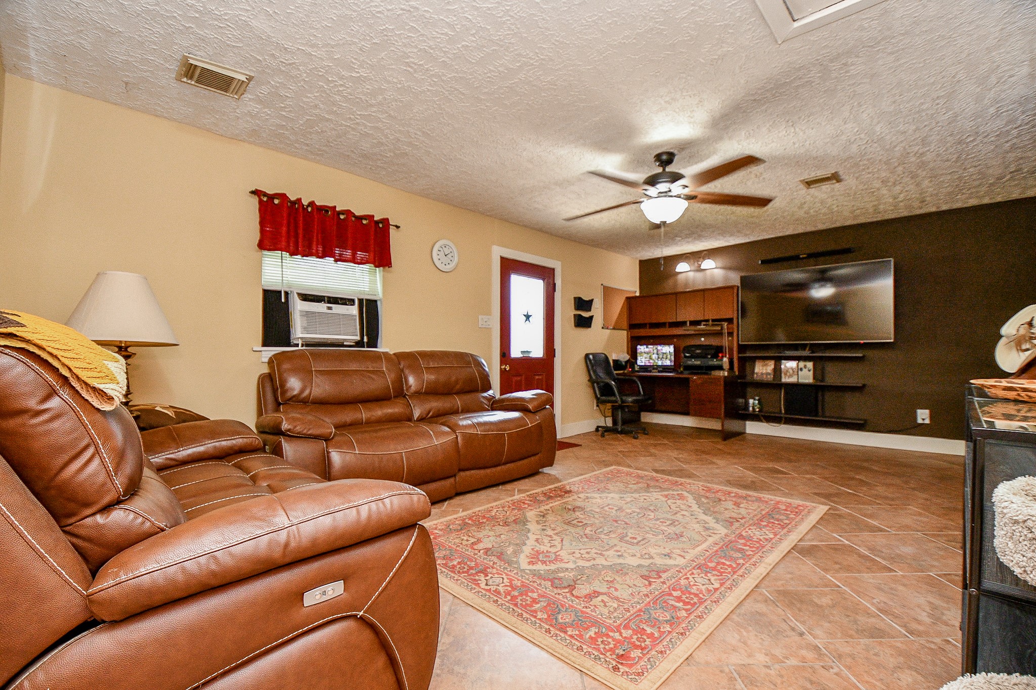 618 Keith Avenue Houston, TX 77504 - Photo 32 of 43 a living room with furniture a flat screen tv and kitchen view