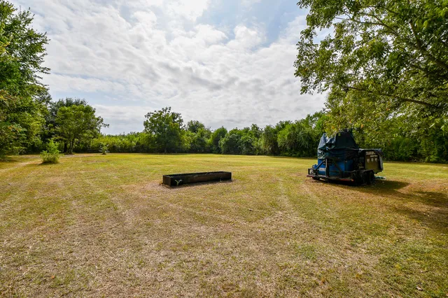 a backyard of a house with lots of green space