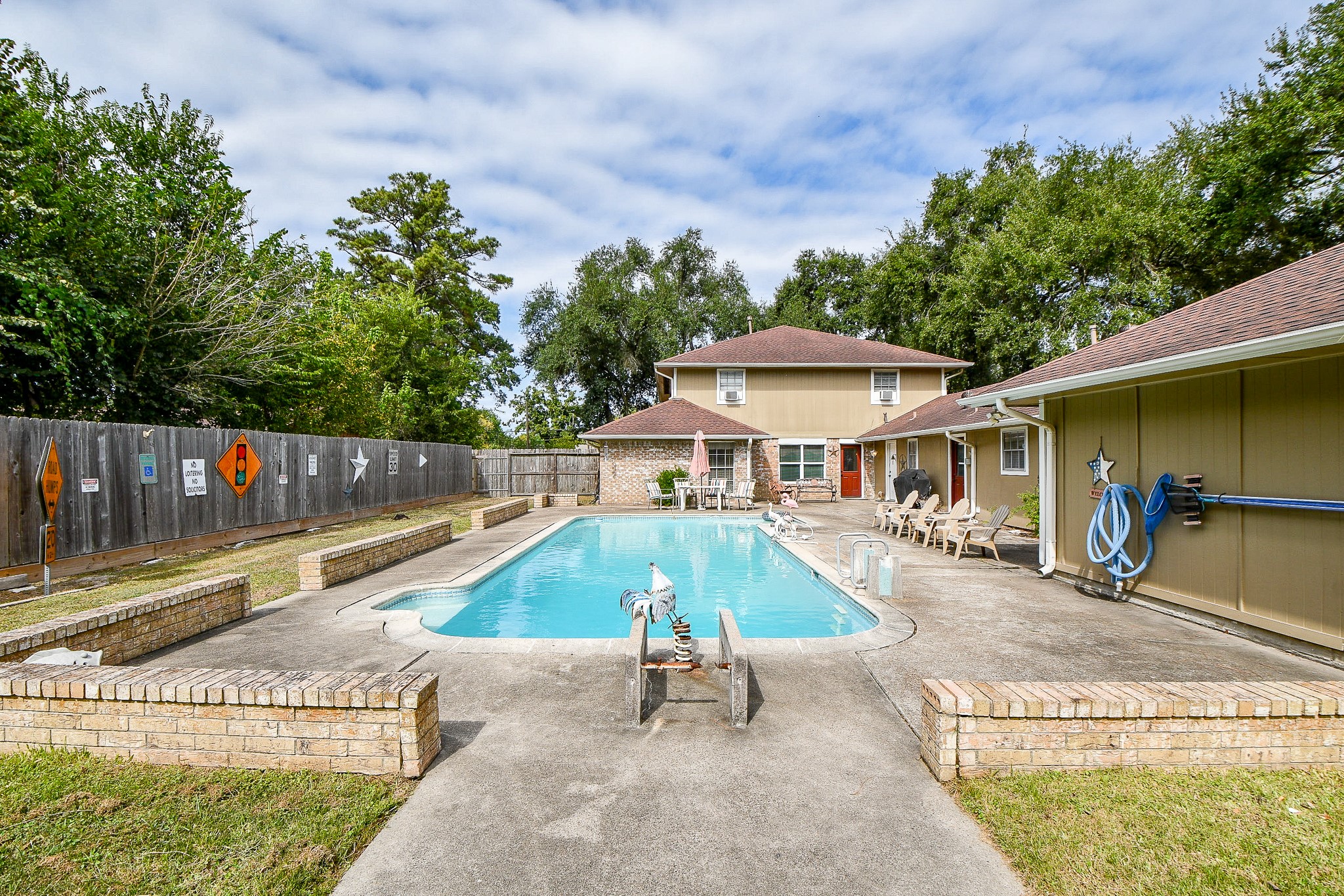 618 Keith Avenue Houston, TX 77504 - Photo 38 of 43 an outdoor space with pool and furniture