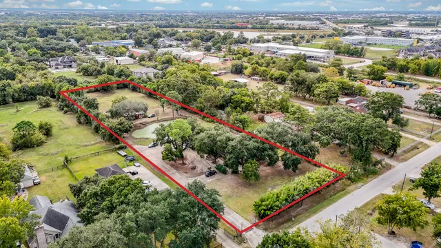 an aerial view of a residential houses with outdoor space