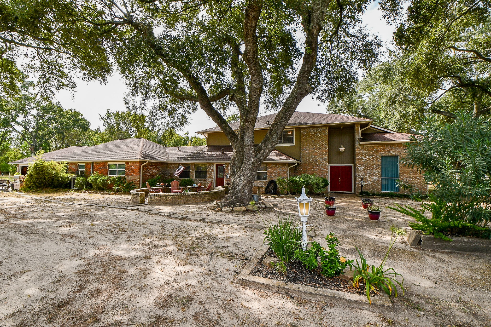 618 Keith Avenue Houston, TX 77504 - Photo 41 of 43 a view of a patio with table and chairs under an umbrella
