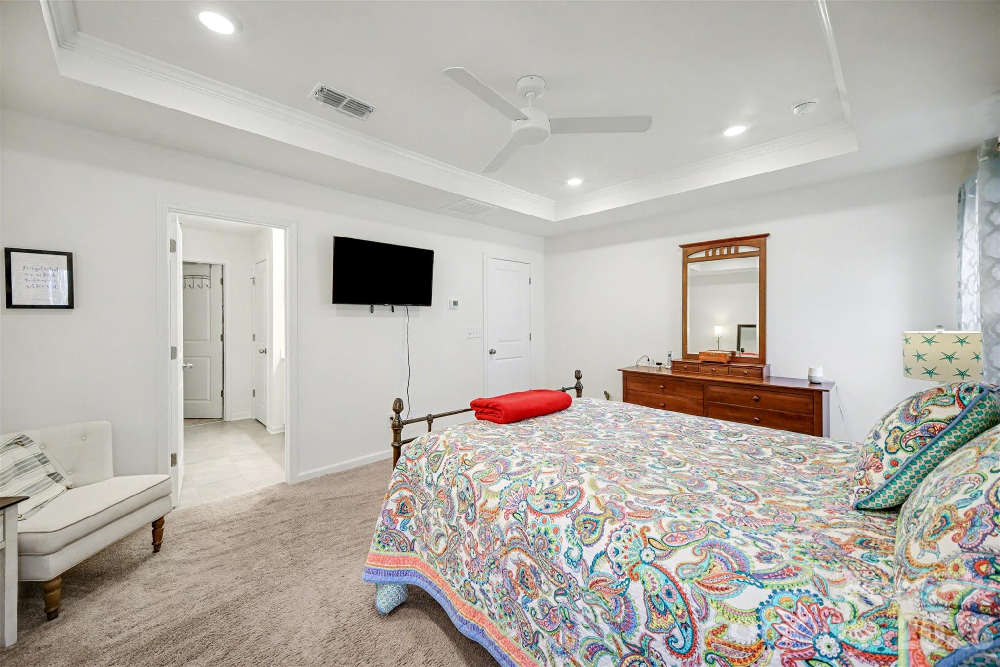226 Quinn Road Matthews, NC 28104 - Photo 20 of 30 a bedroom with a bed and a flat screen tv