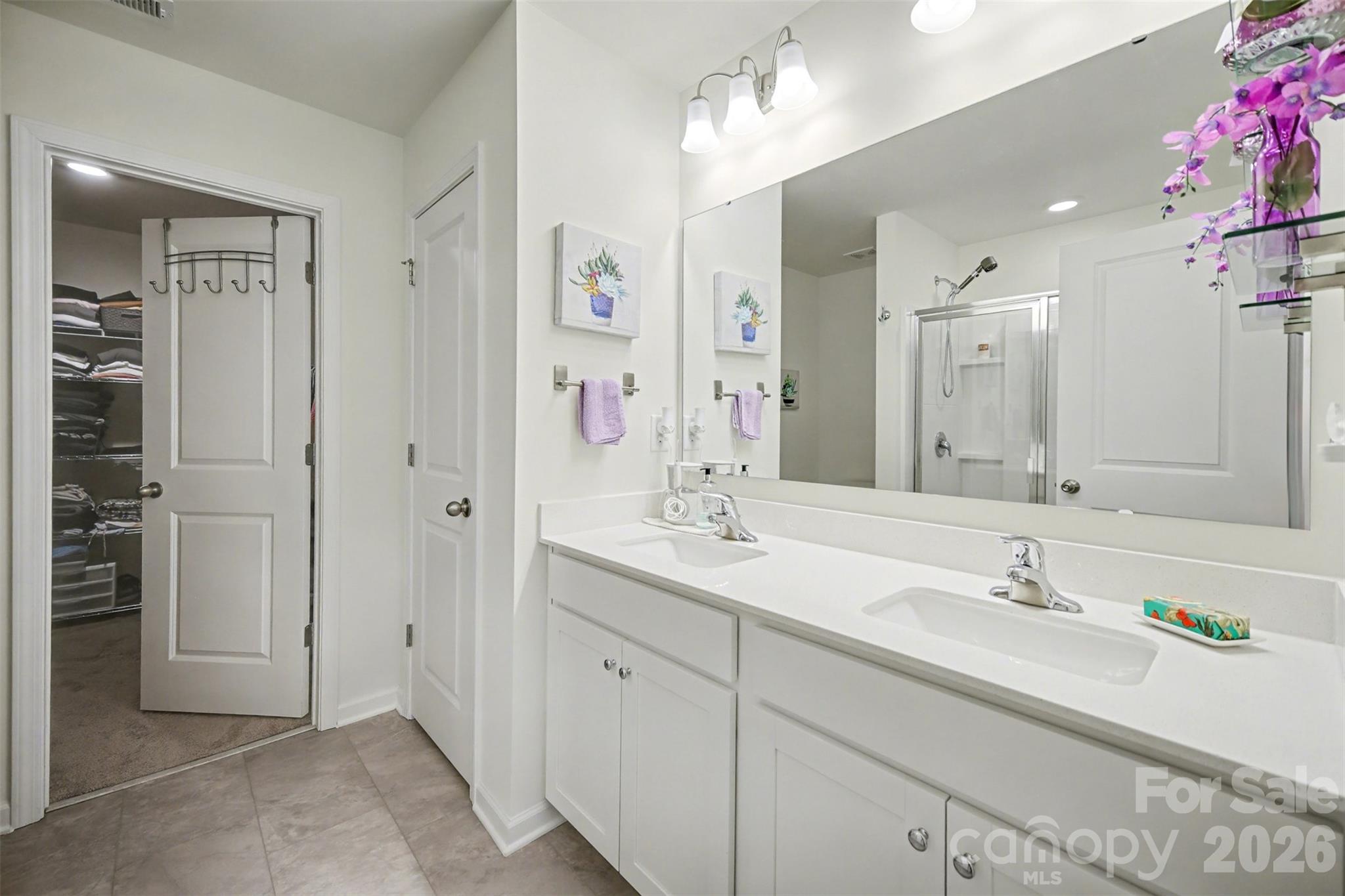 226 Quinn Road Matthews, NC 28104 - Photo 21 of 30 a bathroom with a sink double vanity and a mirror
