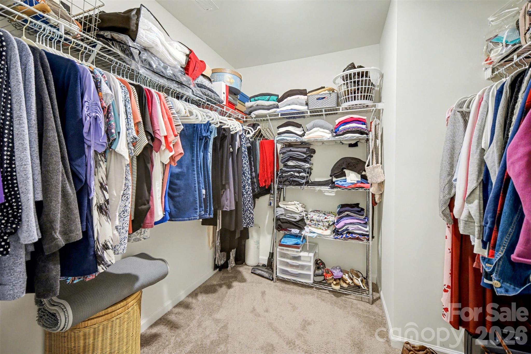 226 Quinn Road Matthews, NC 28104 - Photo 23 of 30 a view of walk in closet with clothes