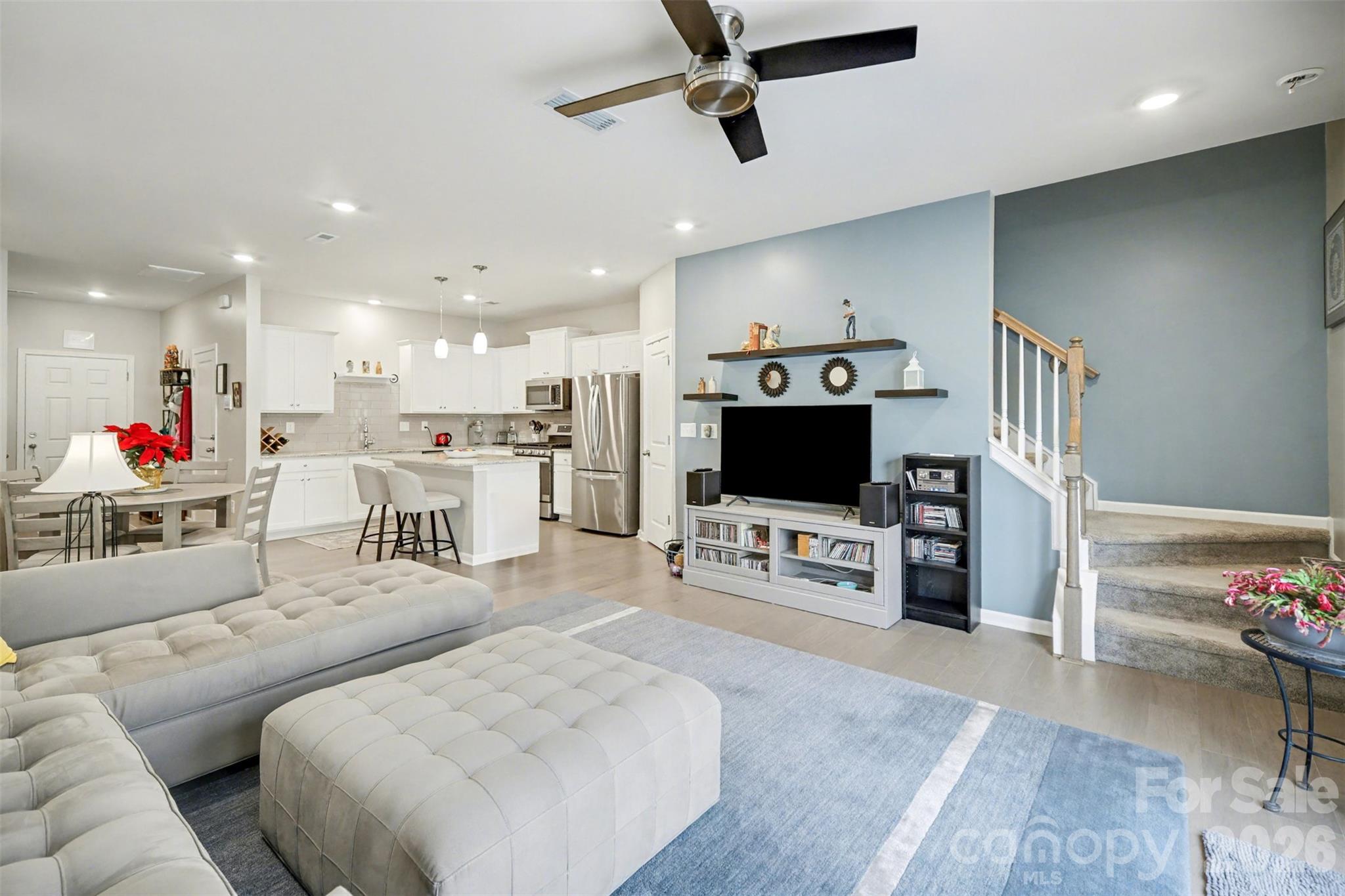 226 Quinn Road Matthews, NC 28104 - Photo 4 of 30 a living room with furniture and a flat screen tv