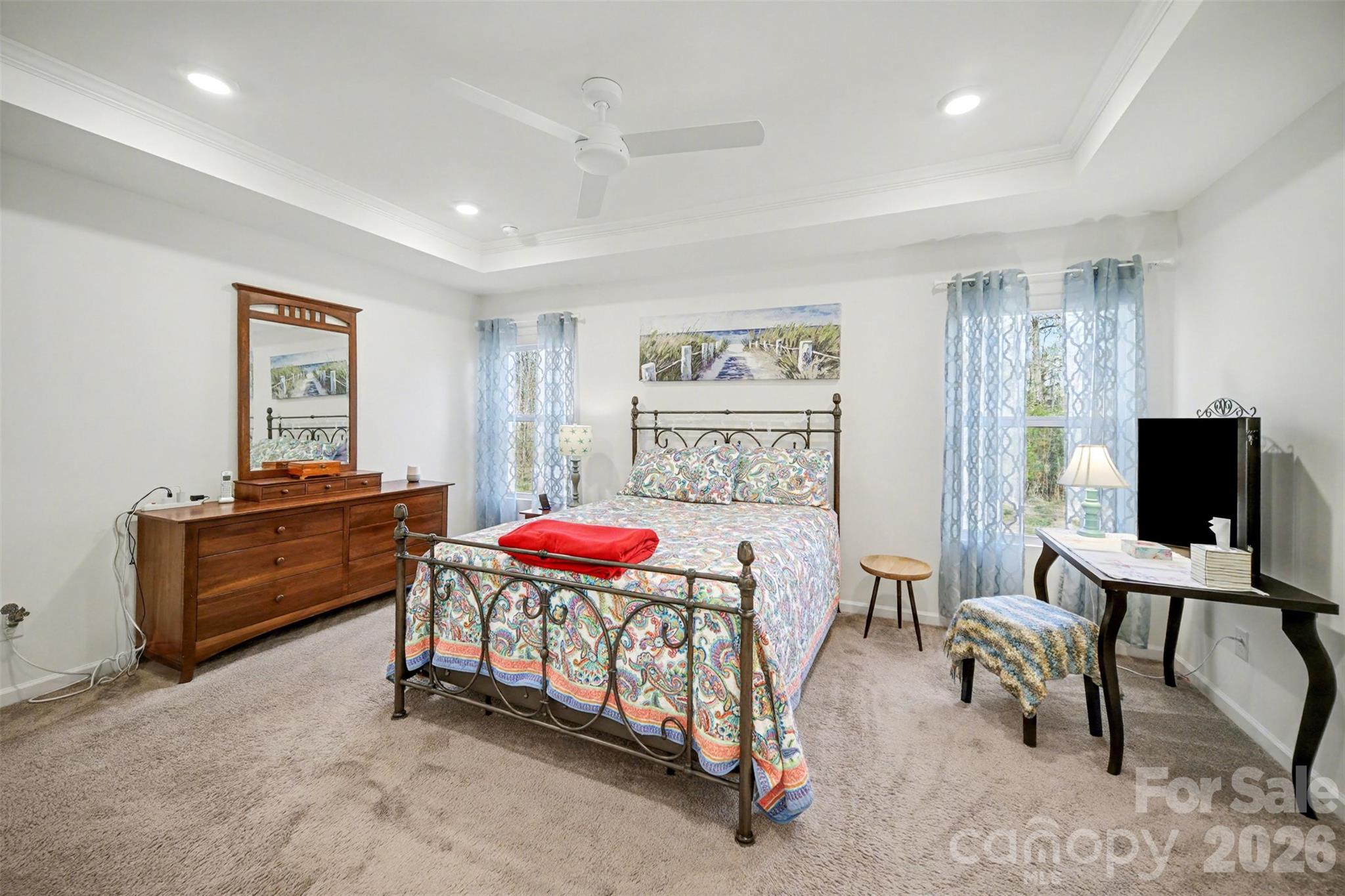 226 Quinn Road Matthews, NC 28104 - Photo 5 of 30 a bedroom with furniture and a flat screen tv