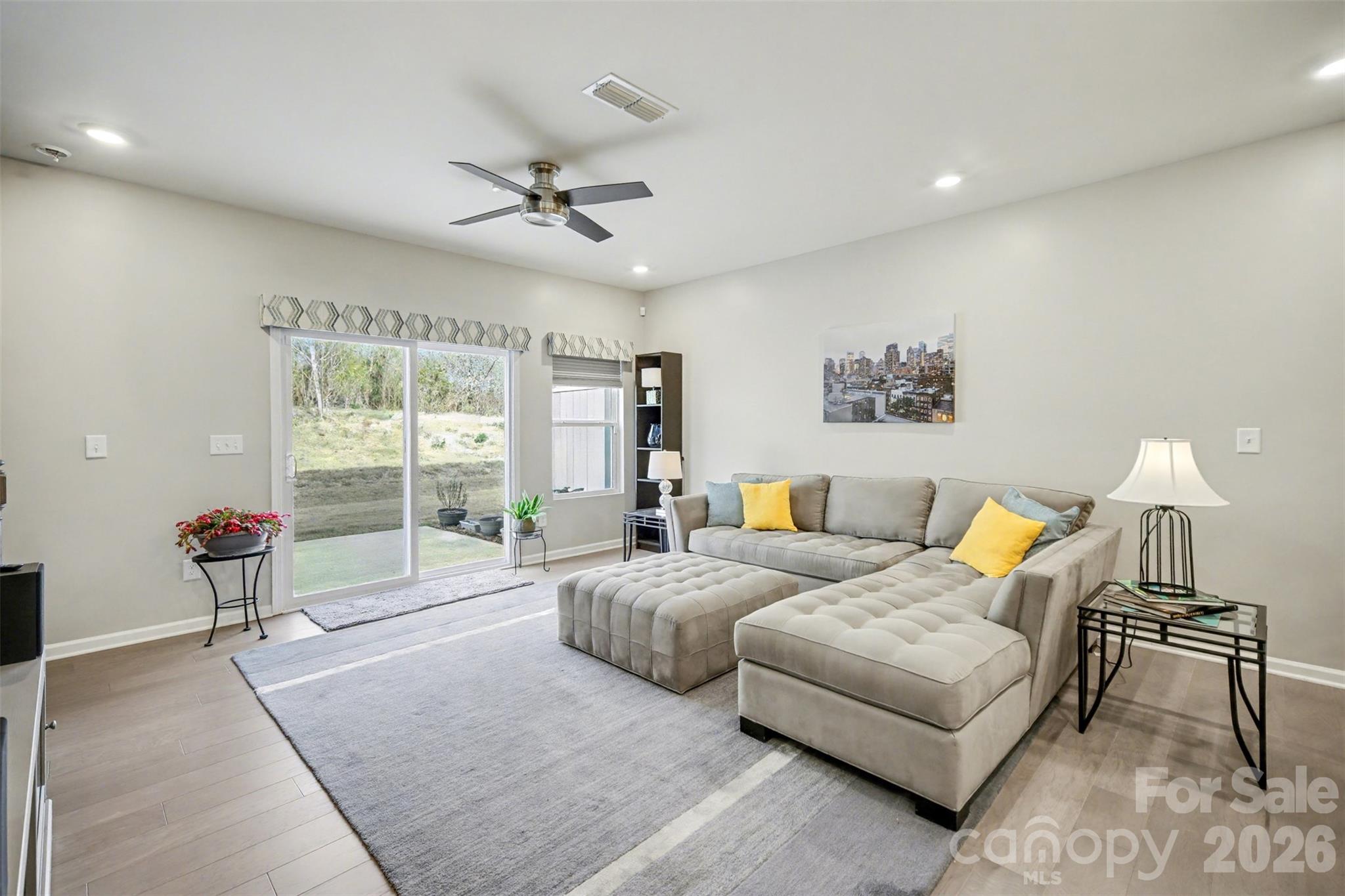 226 Quinn Road Matthews, NC 28104 - Photo 8 of 30 a spacious bedroom with a bed and a couch