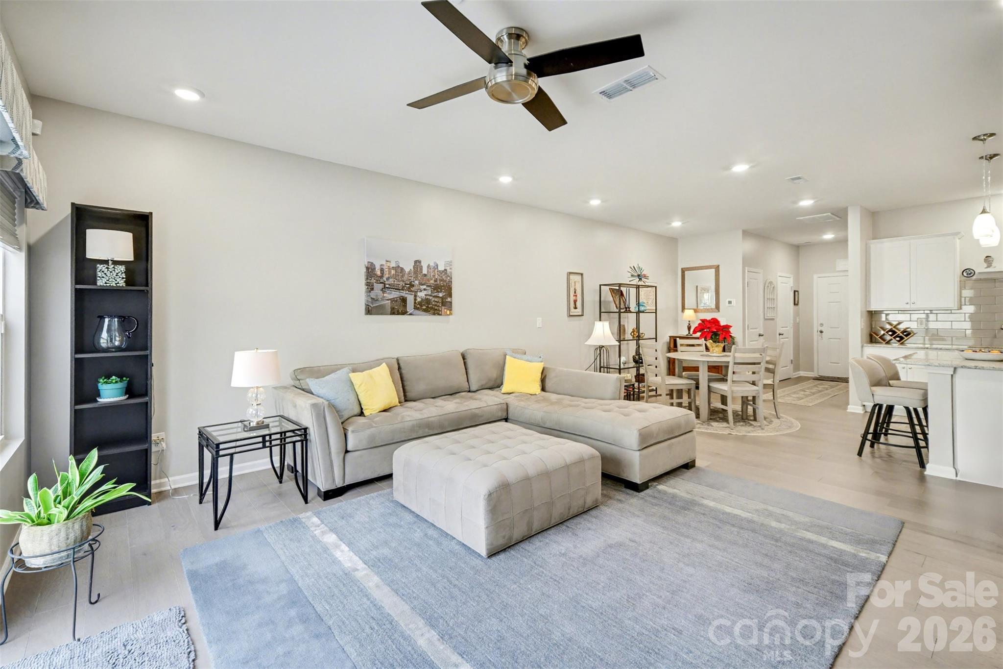 226 Quinn Road Matthews, NC 28104 - Photo 10 of 30 a living room with furniture and kitchen view