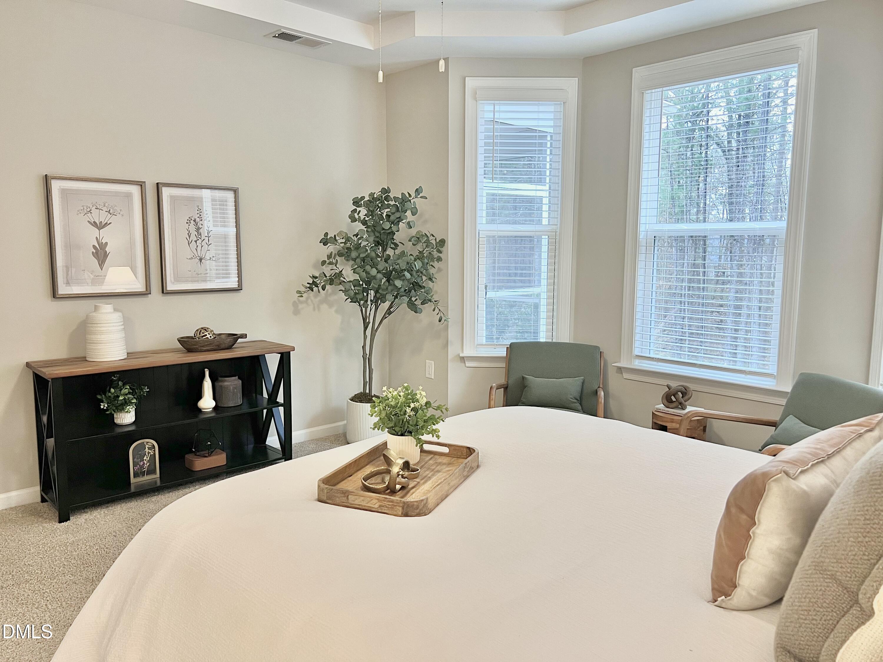 608 Atticus Way Durham, NC 27703 - Photo 10 of 30 a bedroom with a bed and wooden floor