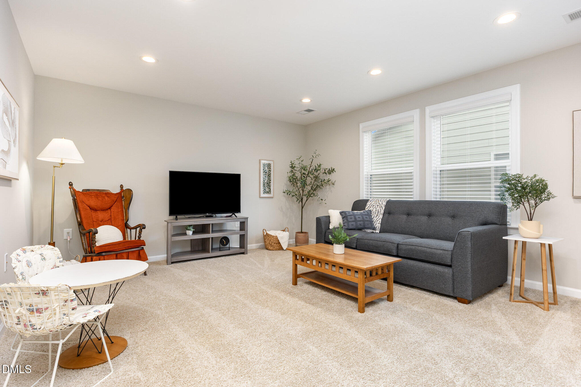 608 Atticus Way Durham, NC 27703 - Photo 15 of 30 a living room with furniture and a flat screen tv