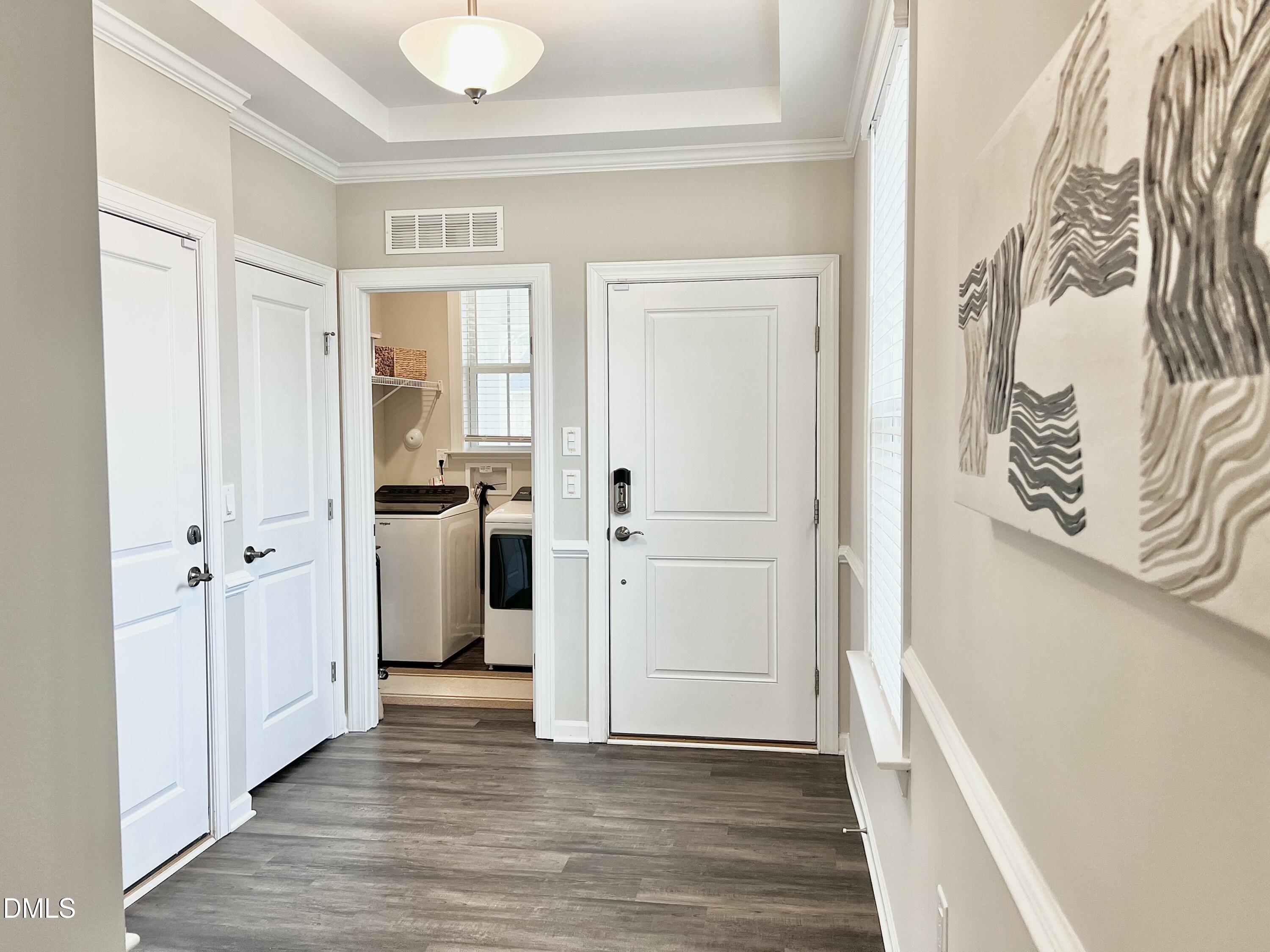 608 Atticus Way Durham, NC 27703 - Photo 18 of 30 a view of a hallway with wooden floor and closet