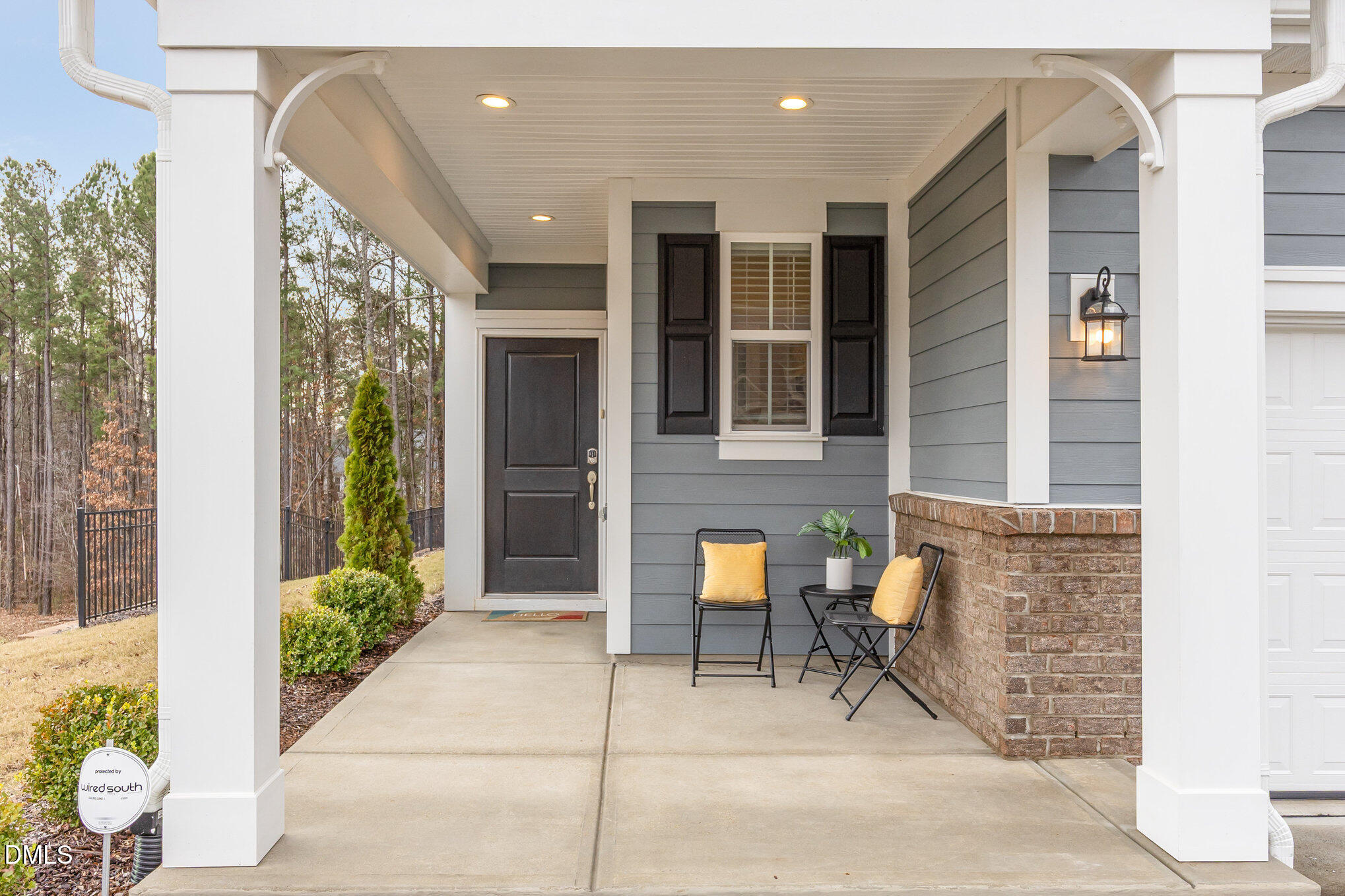 608 Atticus Way Durham, NC 27703 - Photo 2 of 31 a view of a patio with table and chairs and potted plants