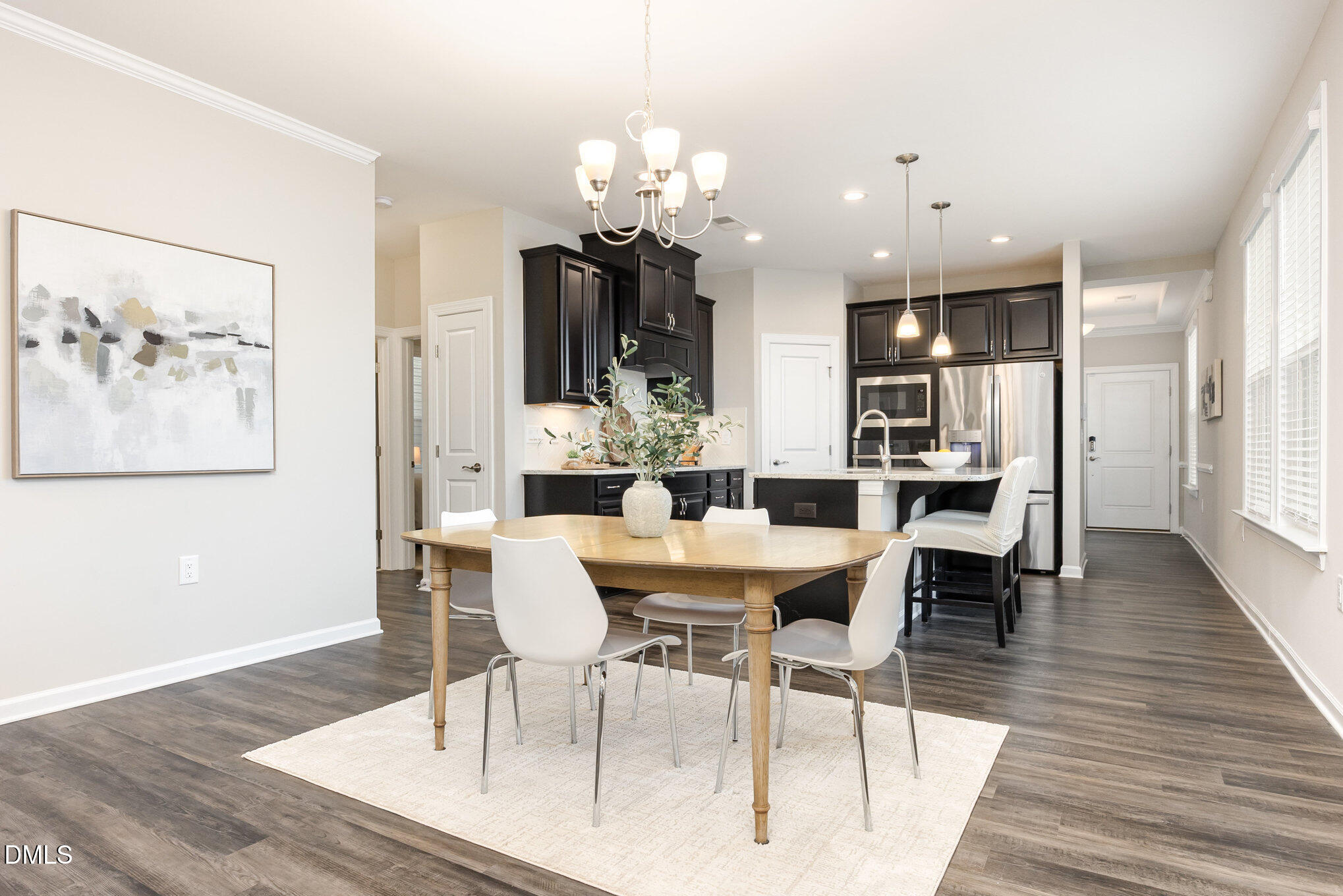 608 Atticus Way Durham, NC 27703 - Photo 3 of 30 a view of a dining room with furniture and wooden floor