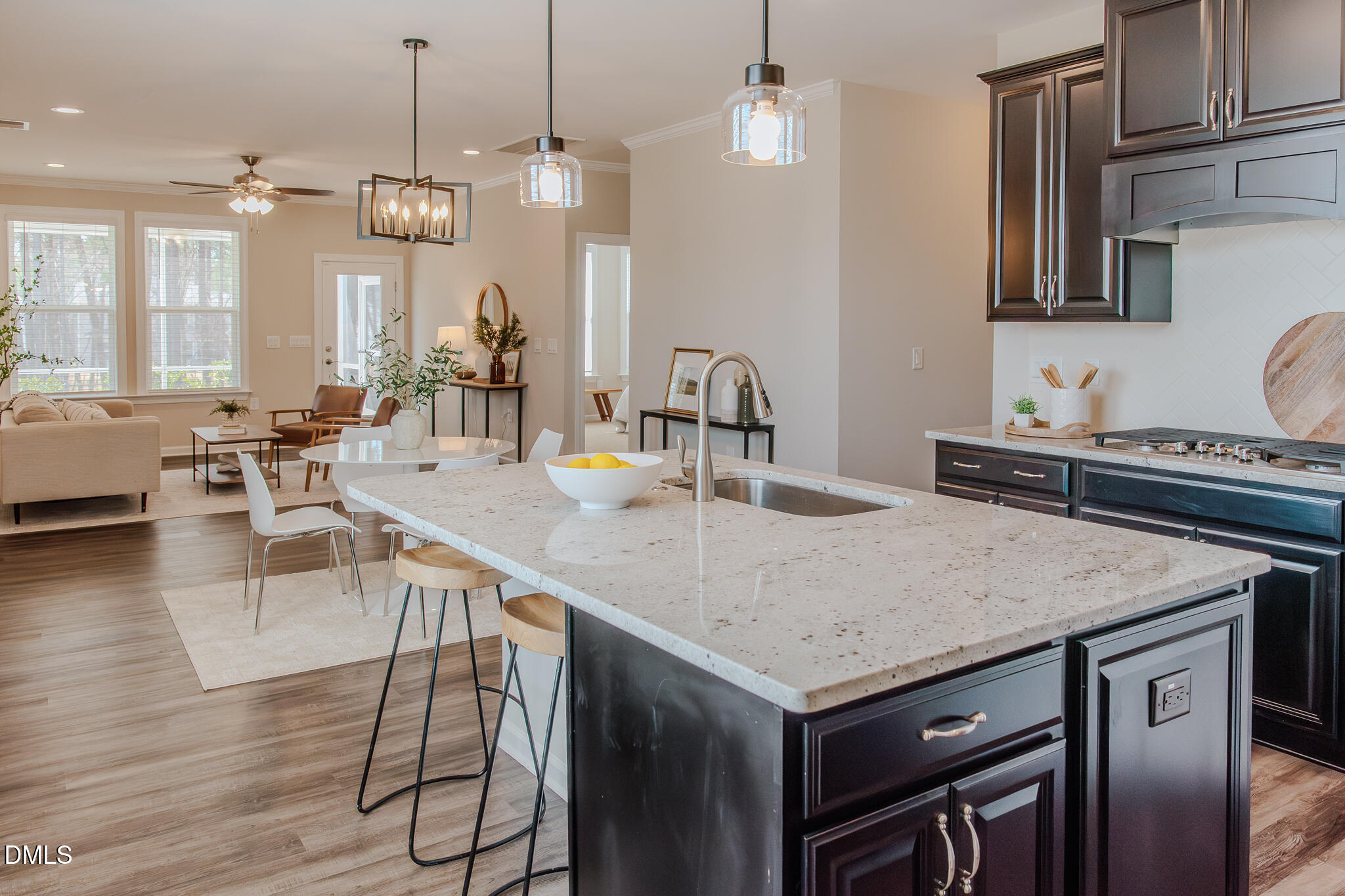 608 Atticus Way Durham, NC 27703 - Photo 5 of 31 a kitchen with a table chairs and wooden floor