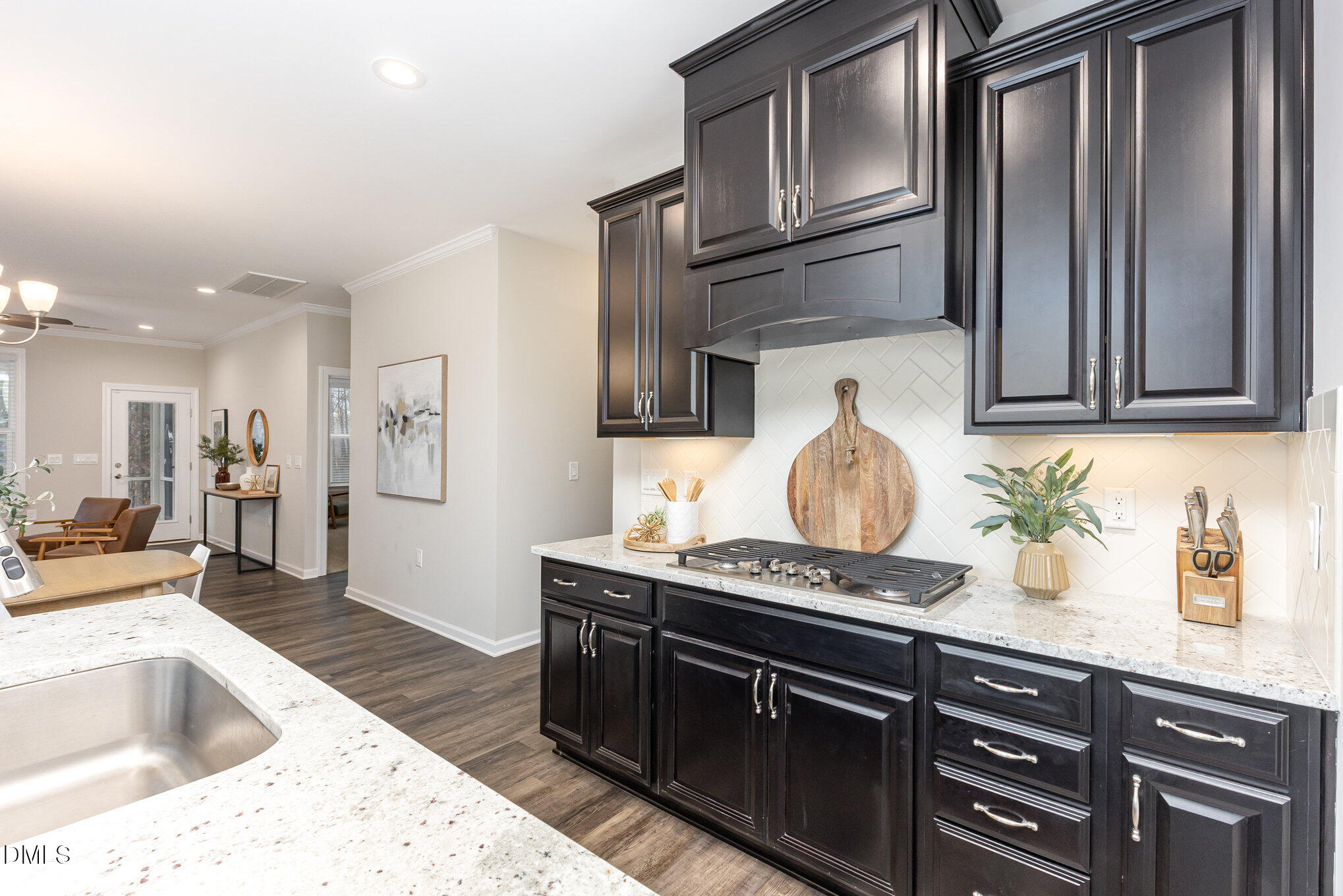 608 Atticus Way Durham, NC 27703 - Photo 4 of 30 a kitchen with stainless steel appliances granite countertop a sink stove and refrigerator