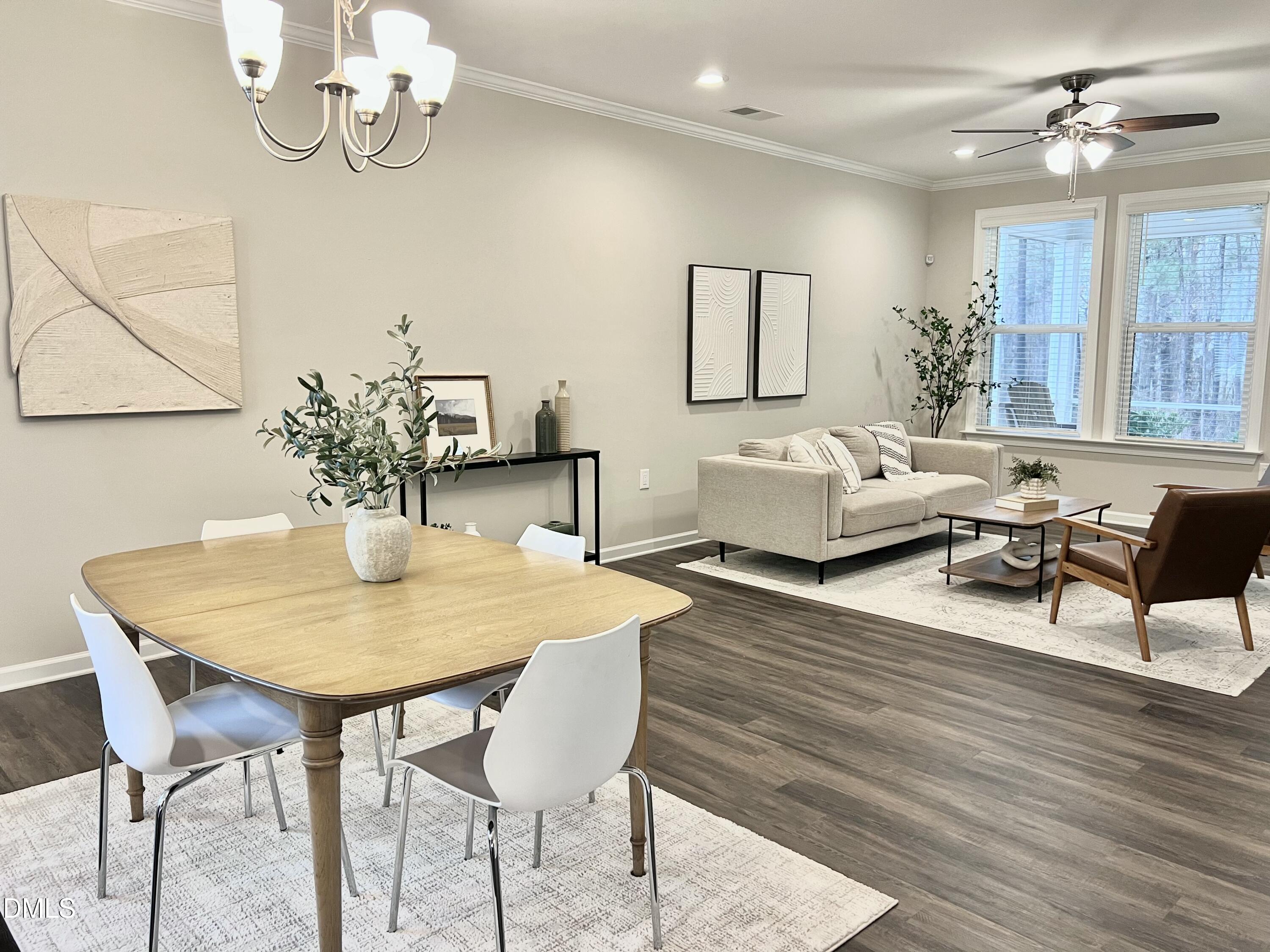 608 Atticus Way Durham, NC 27703 - Photo 6 of 30 a view of a dining room with furniture and wooden floor