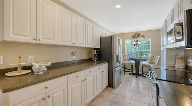 a kitchen with a sink and a refrigerator