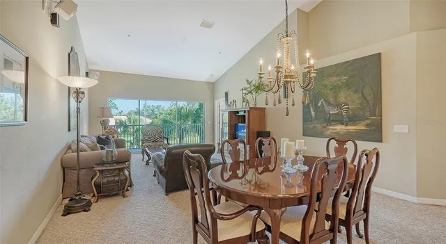 a view of a dining room with furniture window and outside view