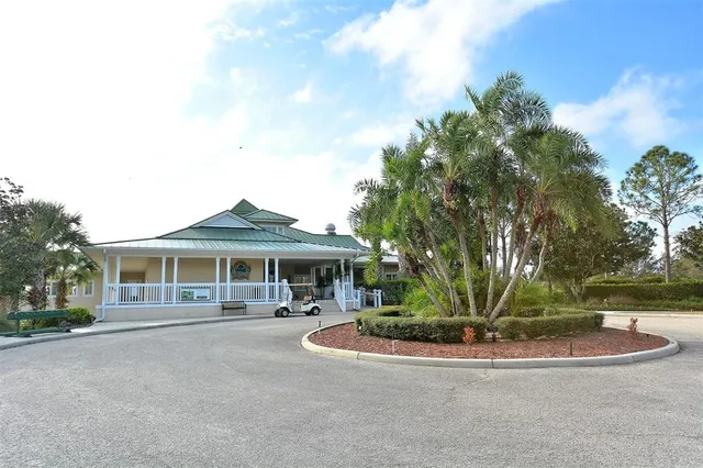 a view of a golf course with a lake