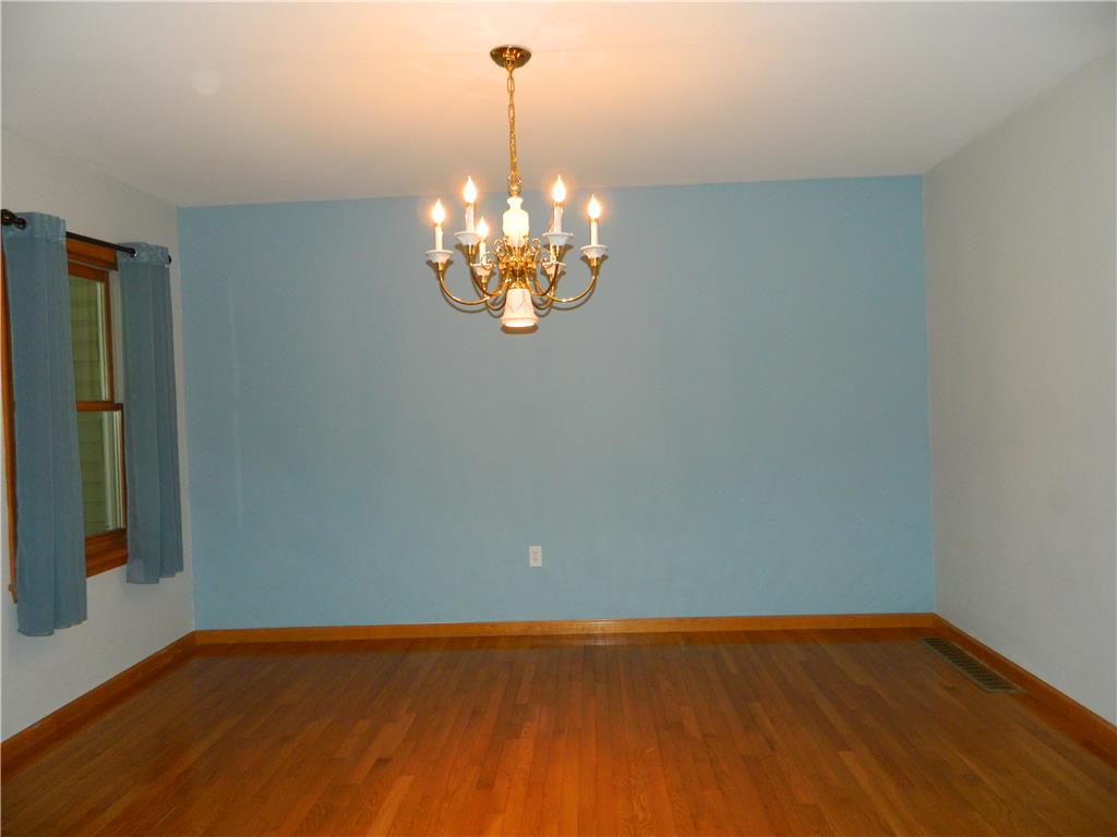 328 Pin Oak Road Stroudsburg, PA 18360 - Photo 13 of 42 A classic chandelier illuminates the polished wood flooring of this versatile room.