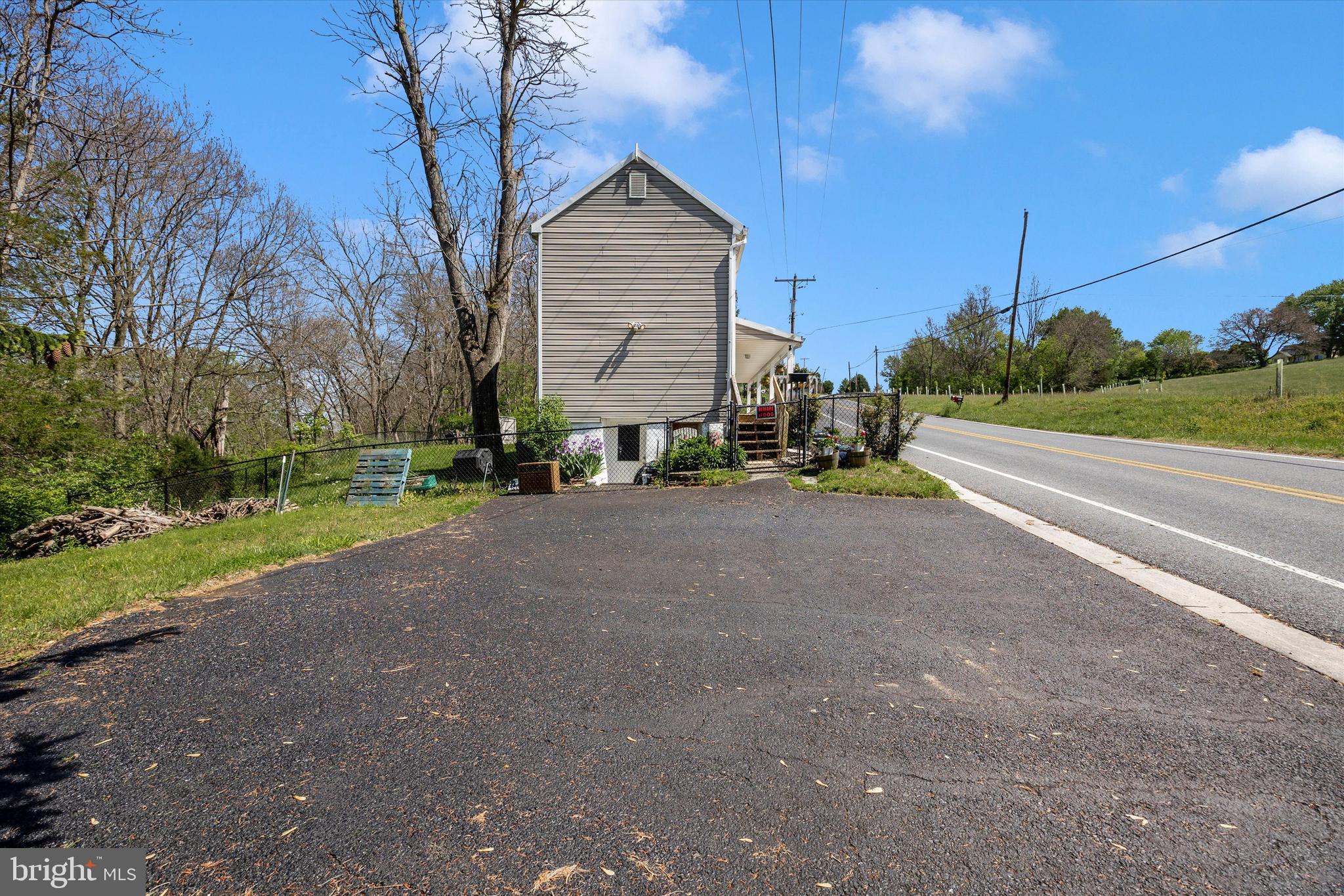 3204 Bidle Road Middletown, MD 21769 - Photo 19 of 23 a view of a house with a yard and garage