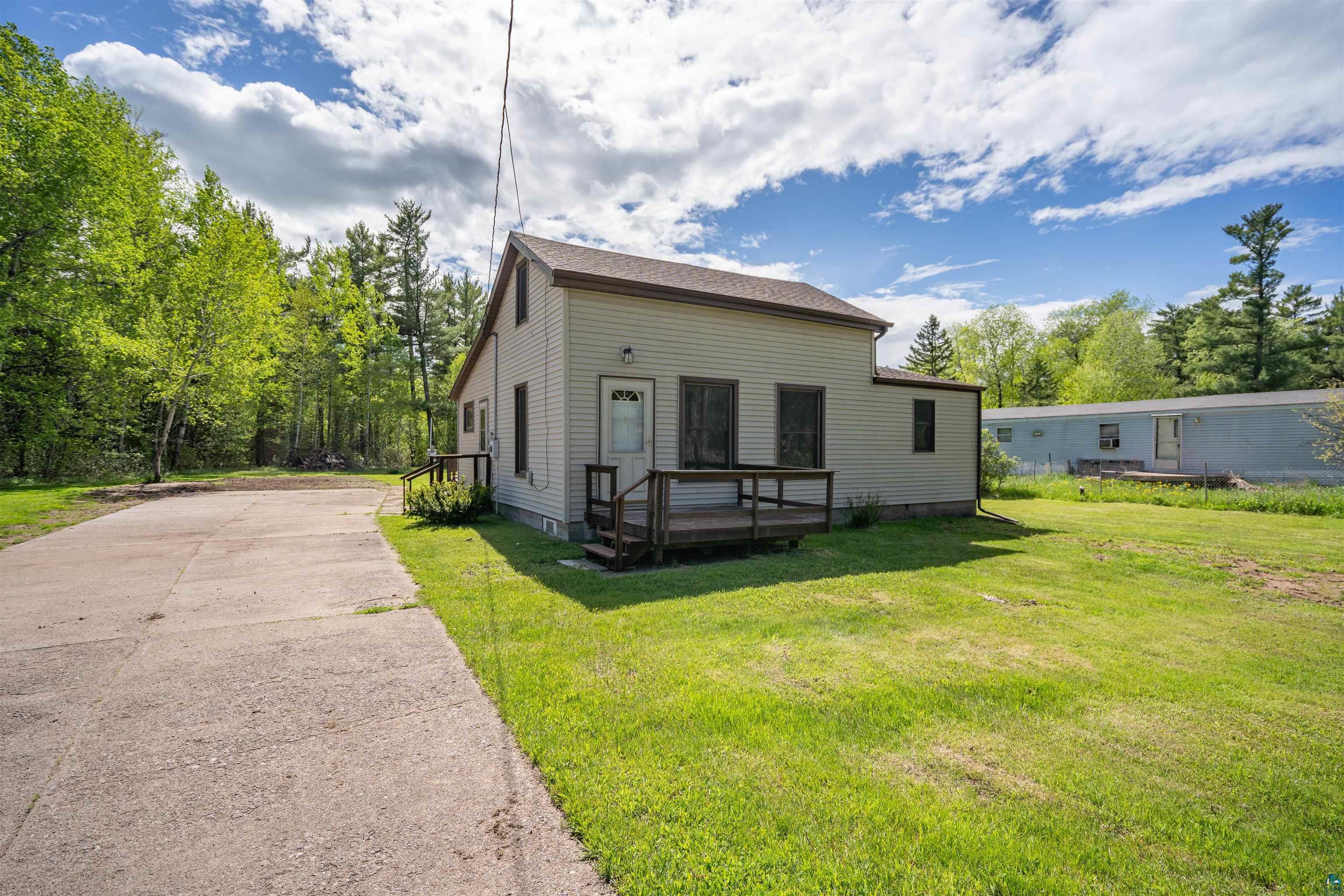 3469 County Road East South Range, WI 54874 - Photo 1 of 19 View of front of property featuring a front yard