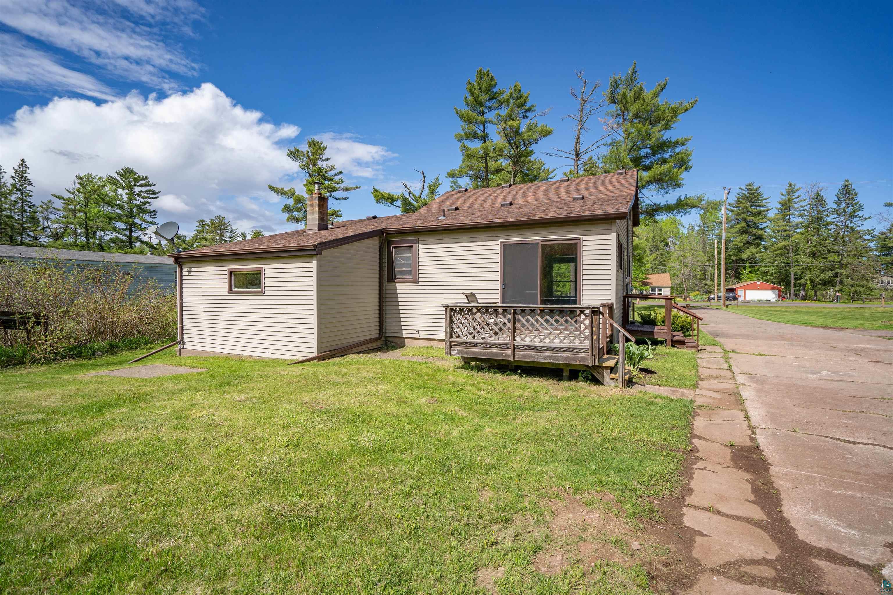 3469 County Road East South Range, WI 54874 - Photo 16 of 19 Back of house with a wooden deck and a yard