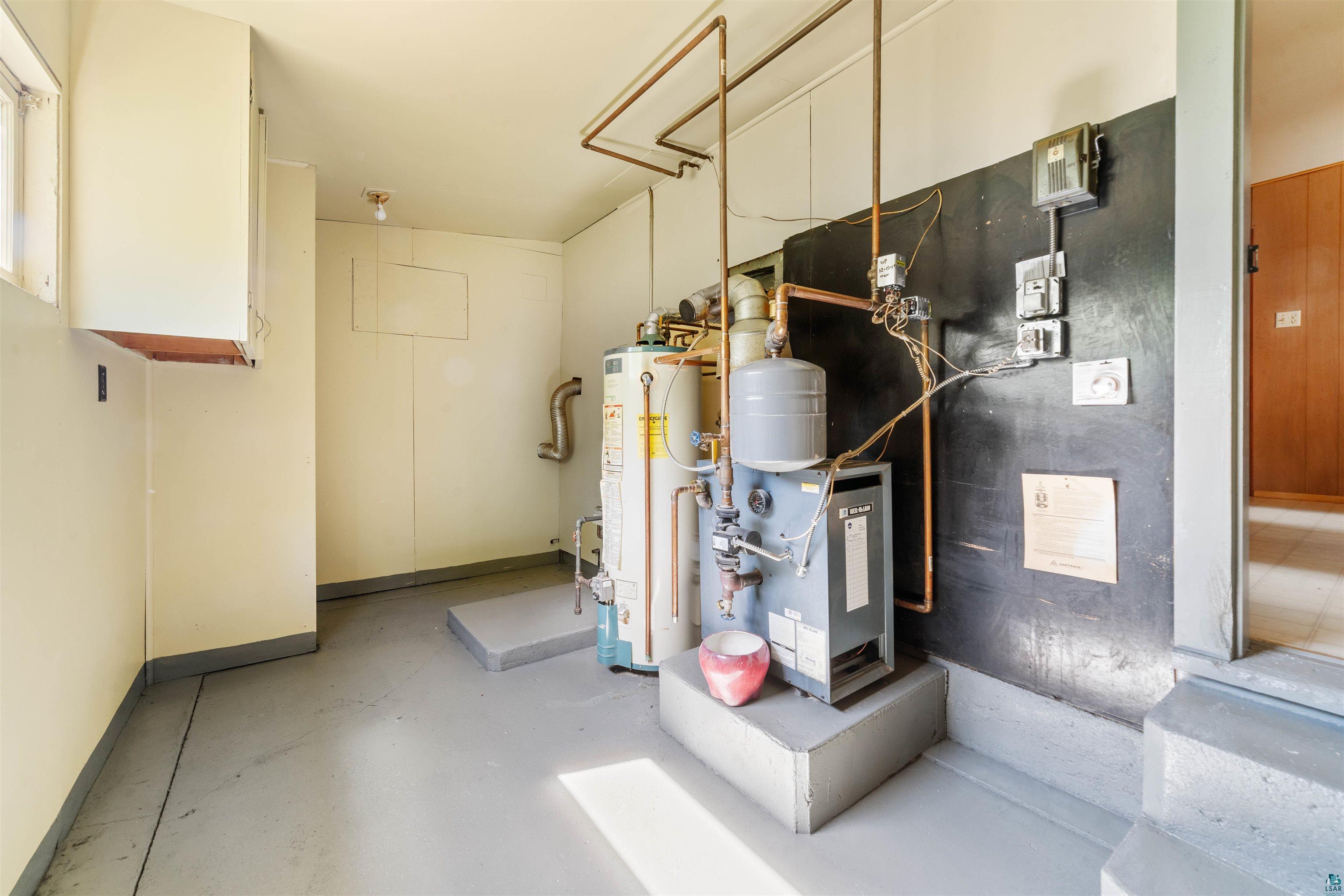 3469 County Road East South Range, WI 54874 - Photo 10 of 19 Utility room featuring gas water heater