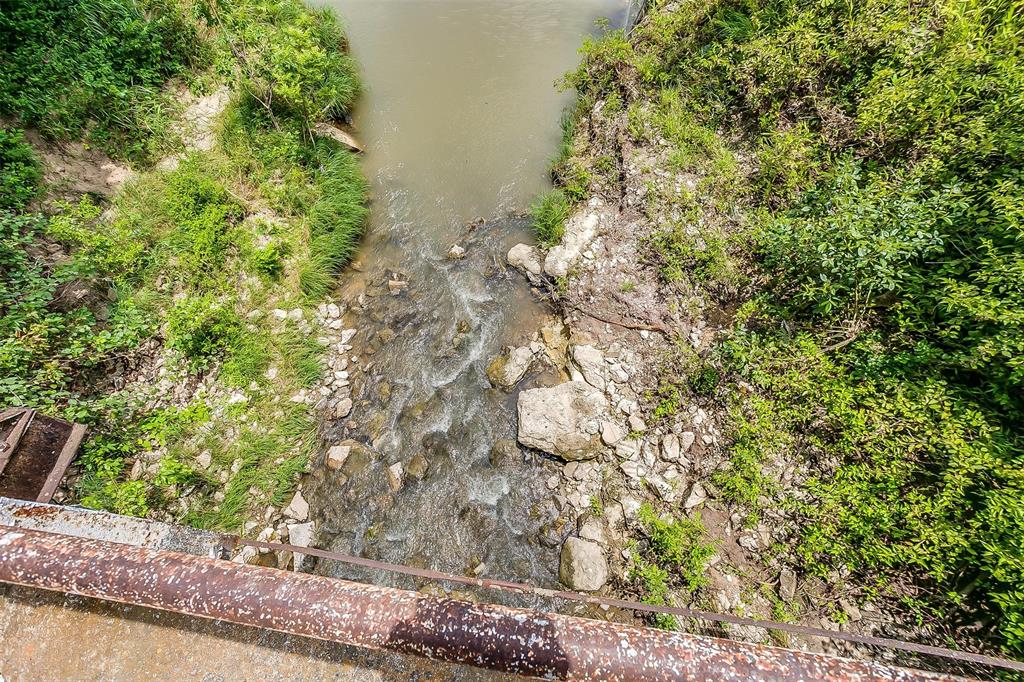 4200 Interstate 20 Willow Park, TX 76087 - Photo 18 of 18 a backyard of a house with lots of green space and fog