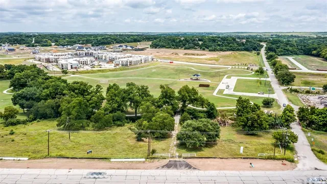 a view of a swimming pool with a yard