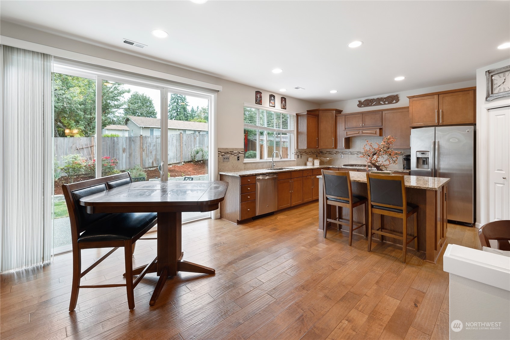 16224 Southeast 138th Place Renton, WA 98059 - Photo 13 of 40 a view of a dining room with furniture window and wooden floor